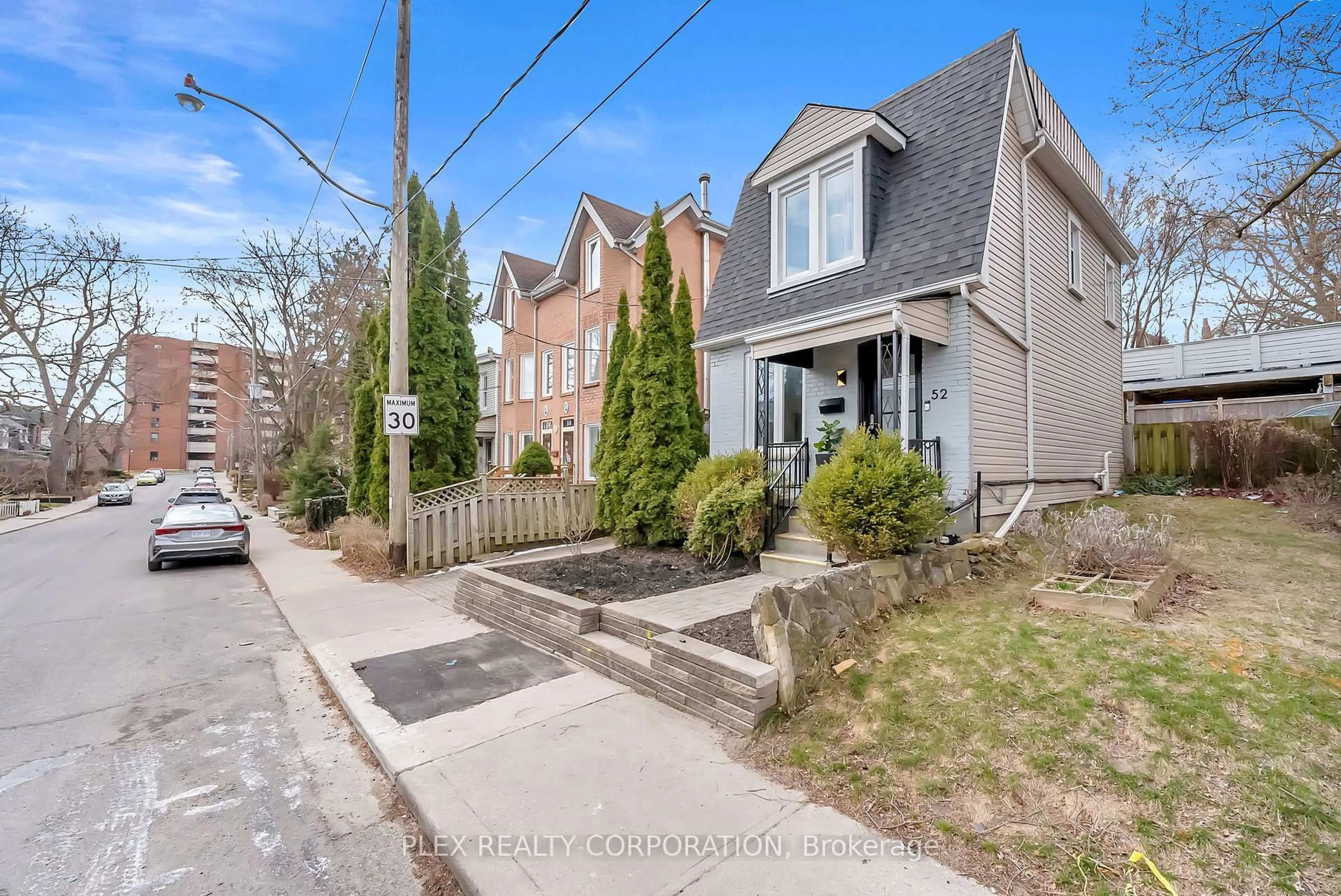 Home with brick exterior material, street for 52 Poucher St, Toronto Ontario M4J 2Y9
