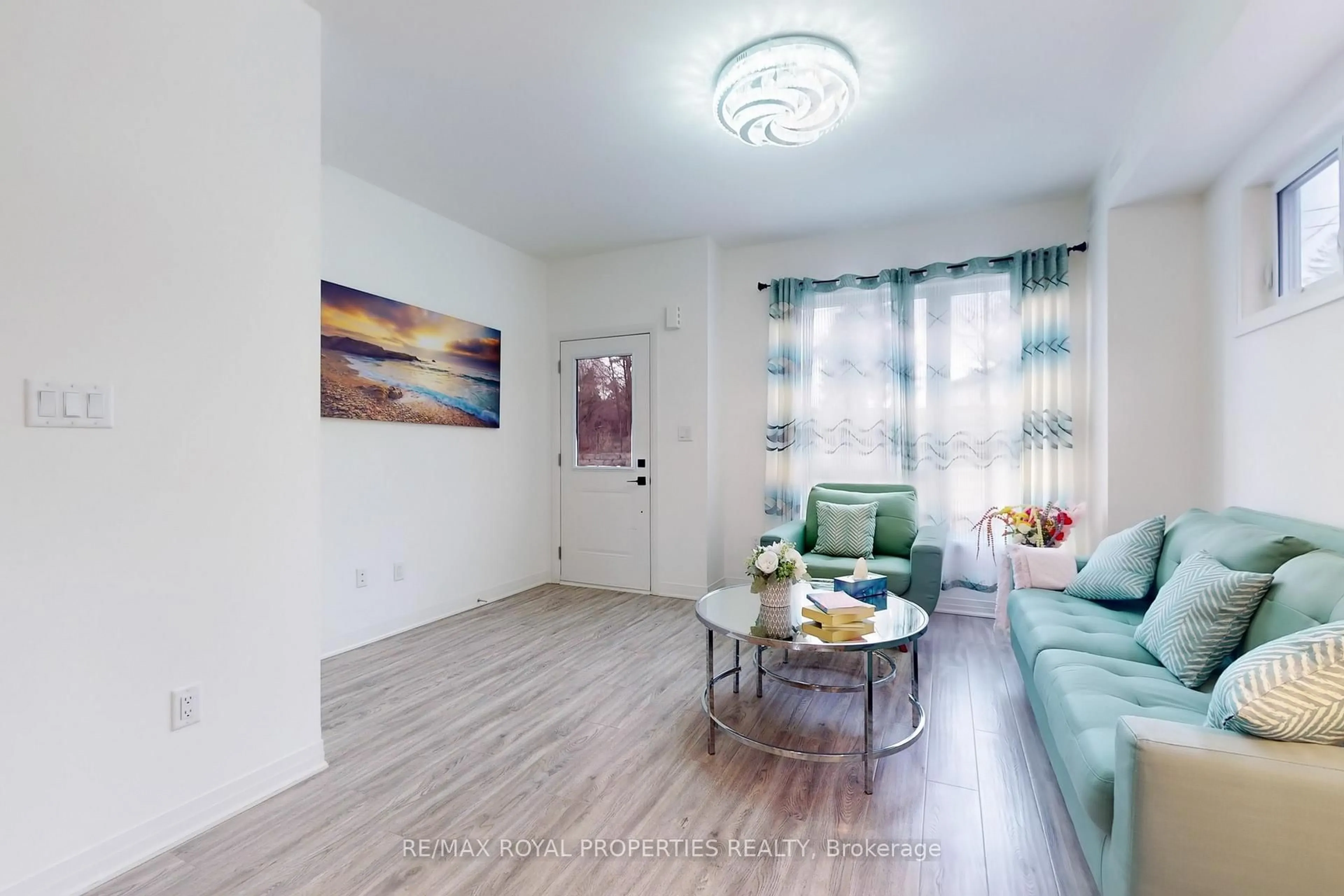 Living room with furniture, wood/laminate floor for 1650 Pleasure Valley Path, Oshawa Ontario L1G 0E3