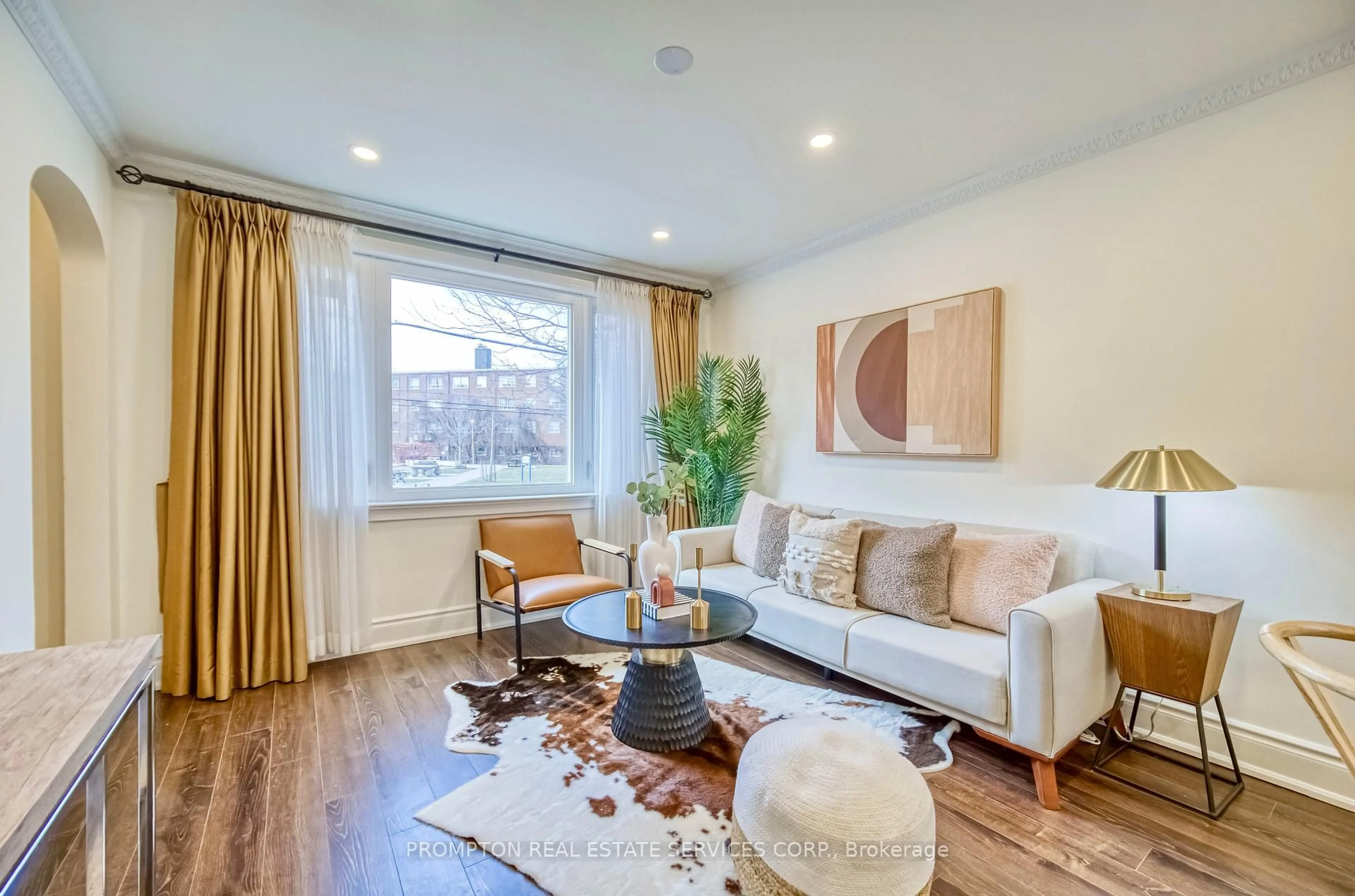 Living room with furniture, wood/laminate floor for 459 Dawes Rd, Toronto Ontario M4B 2E7