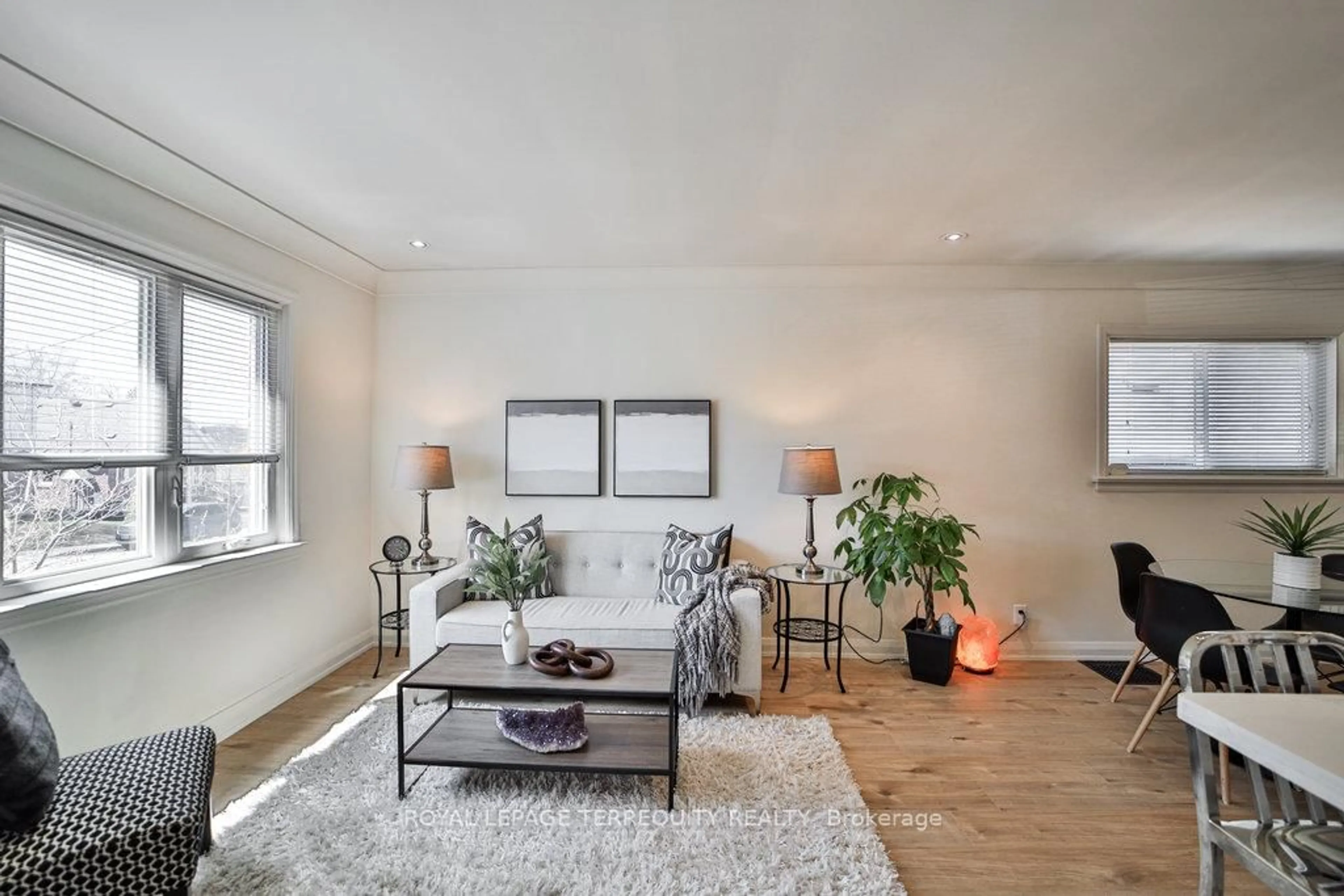 Living room with furniture, wood/laminate floor for 79 Binswood Ave, Toronto Ontario M4C 3N8