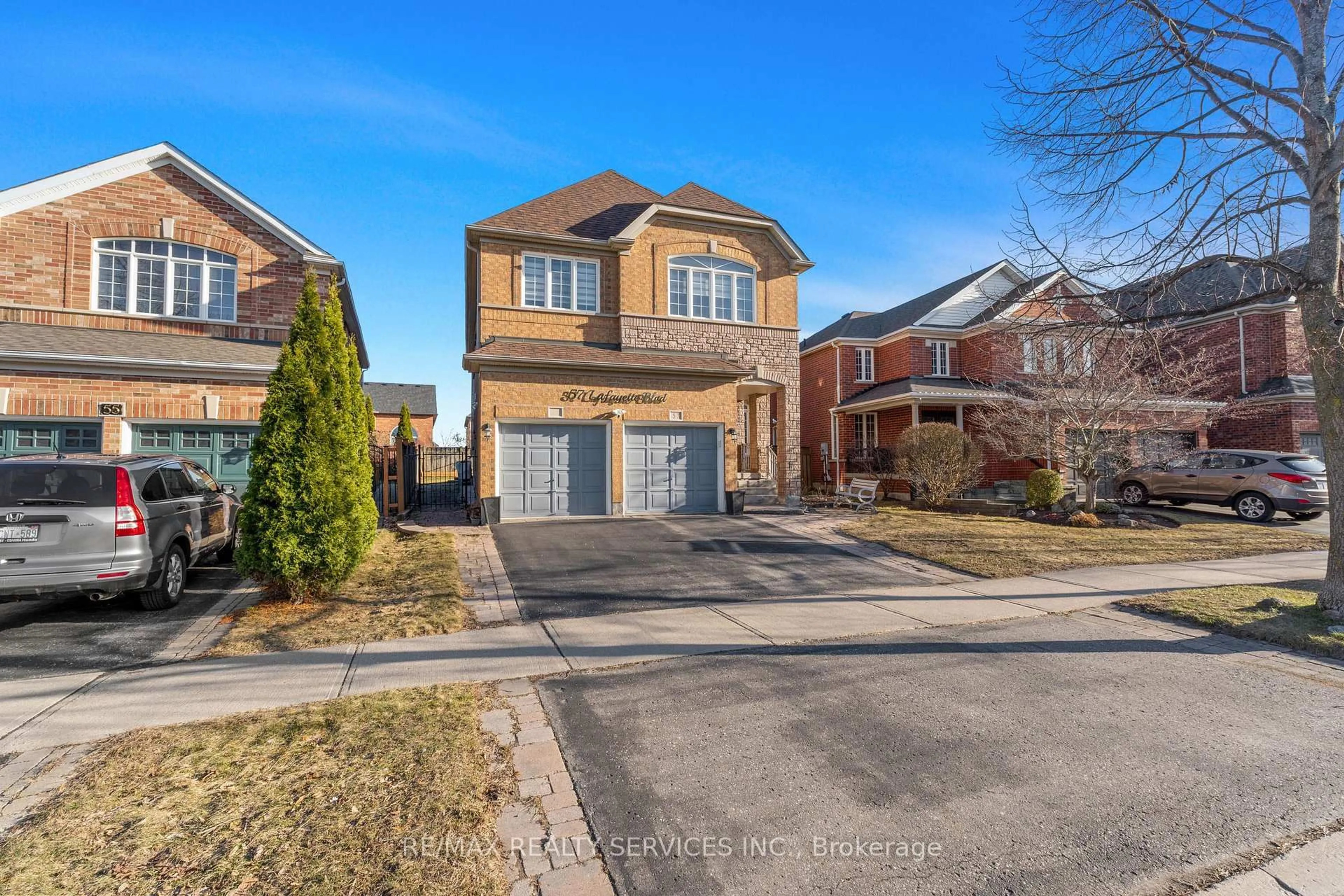 Home with brick exterior material, street for 57 Lafayette Blvd, Whitby Ontario L1P 1T2