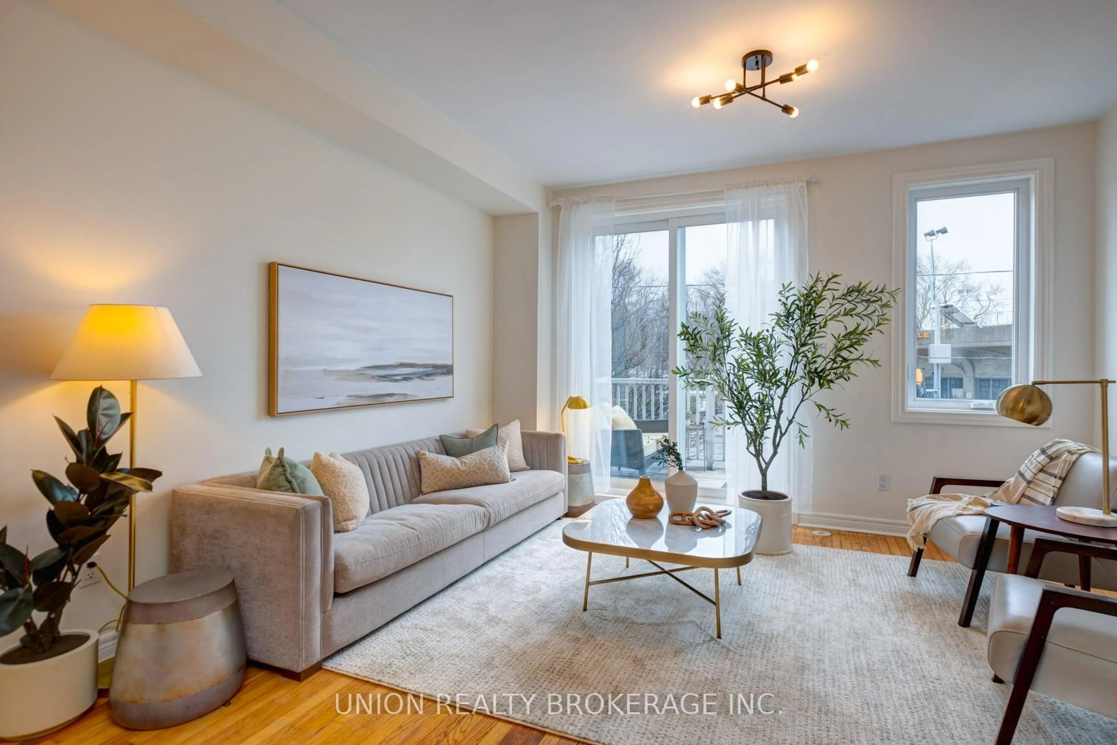 Living room with furniture, wood/laminate floor for 1872 Lake Shore Blvd, Toronto Ontario M4L 6S8