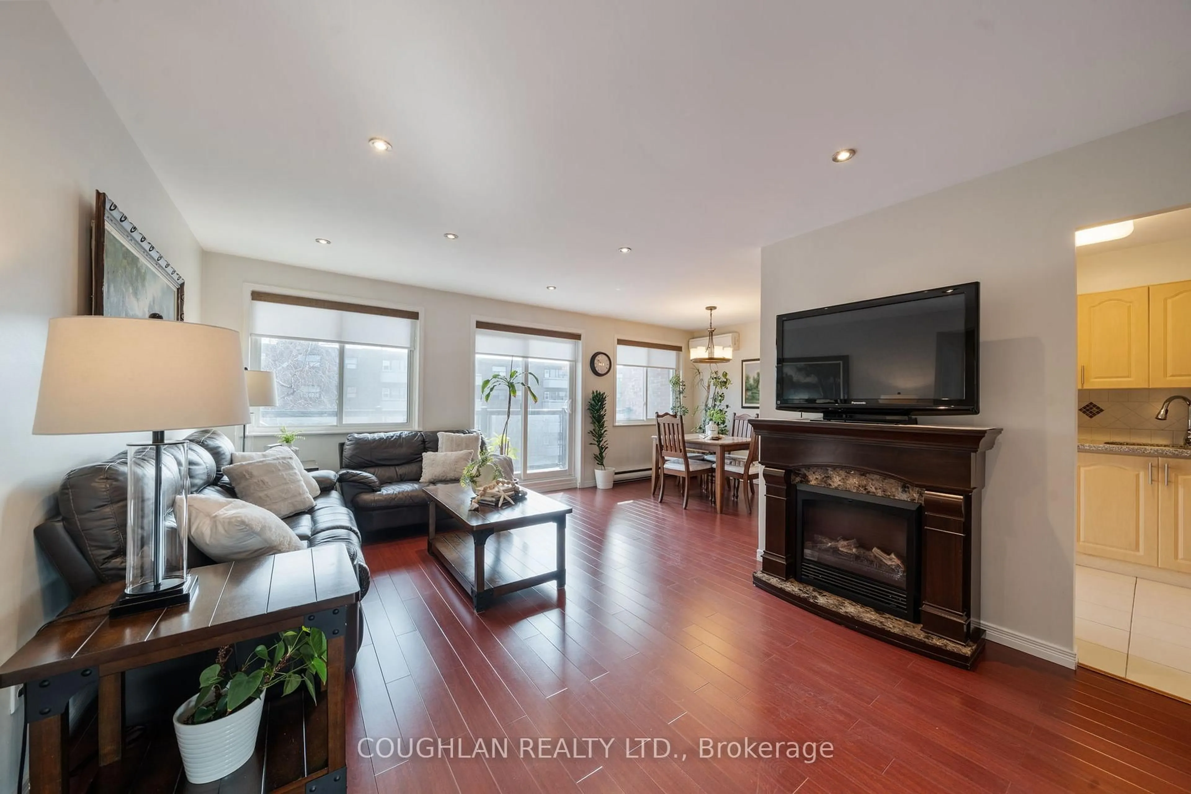 Living room with furniture, wood/laminate floor for 131 Taunton Rd #407, Oshawa Ontario L1G 3T8