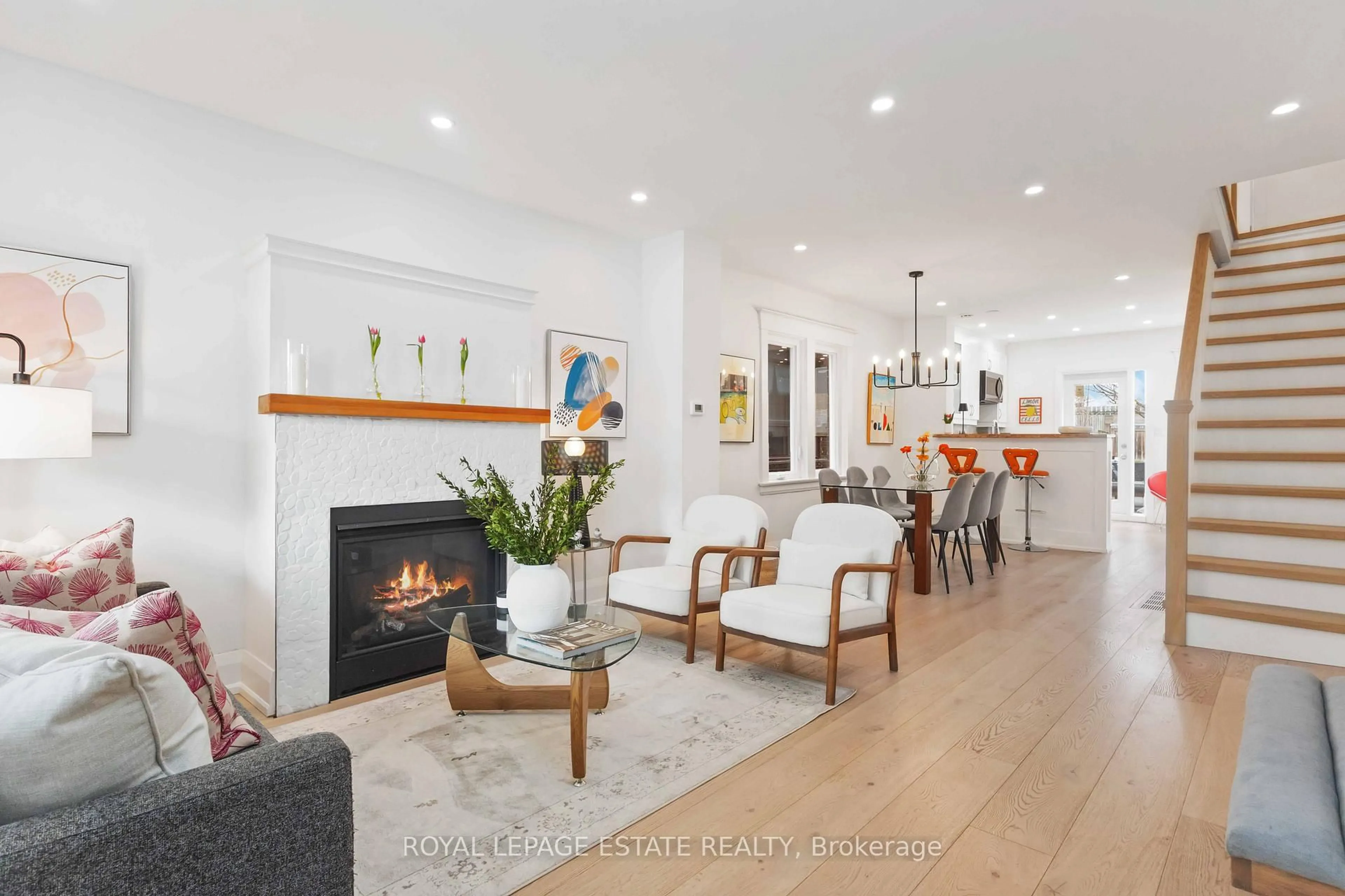 Living room with furniture, wood/laminate floor for 42 Chatham Ave, Toronto Ontario M4J 1K6
