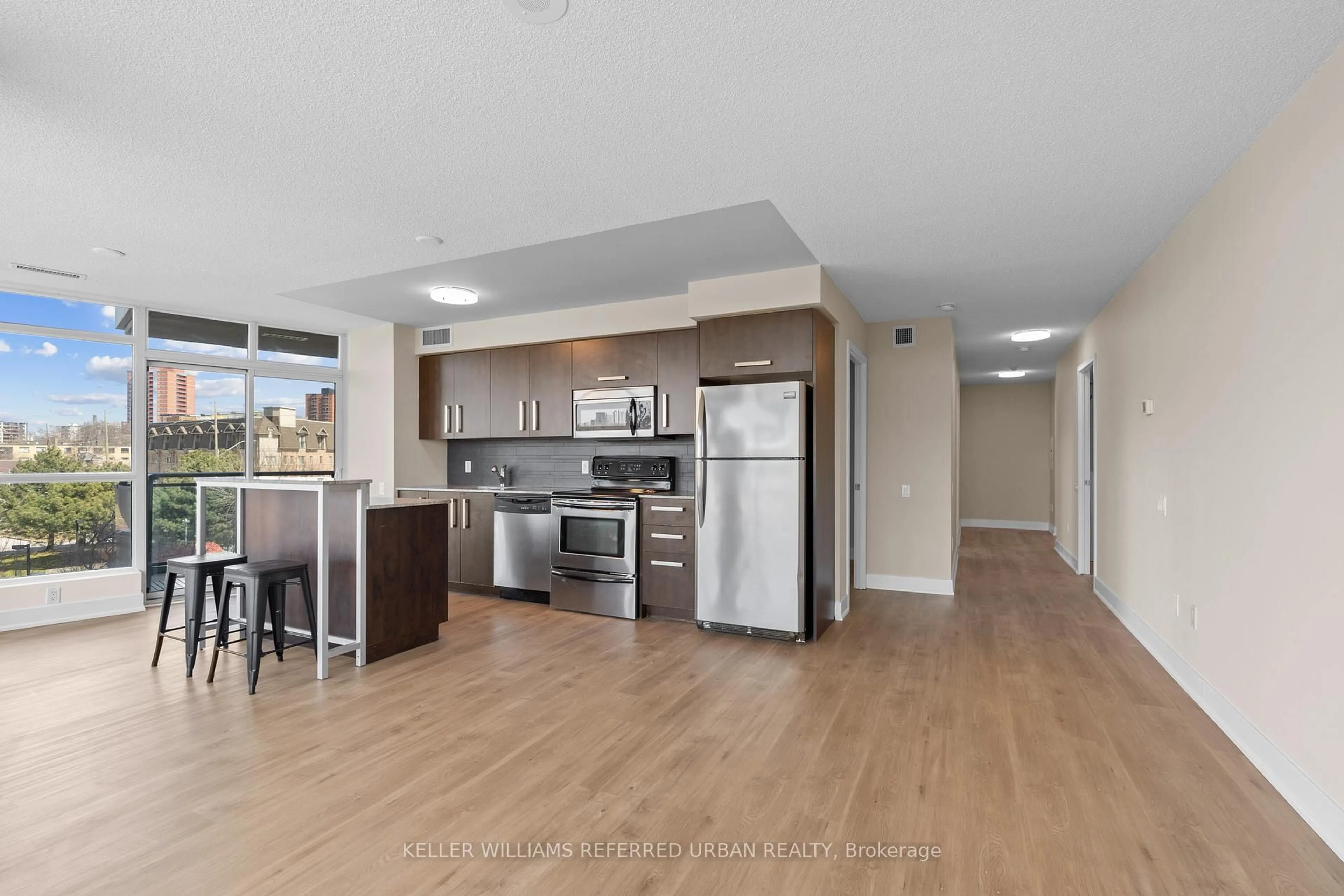 Open concept kitchen, wood/laminate floor for 1048 Broadview Ave #308, Toronto Ontario M4K 2B8