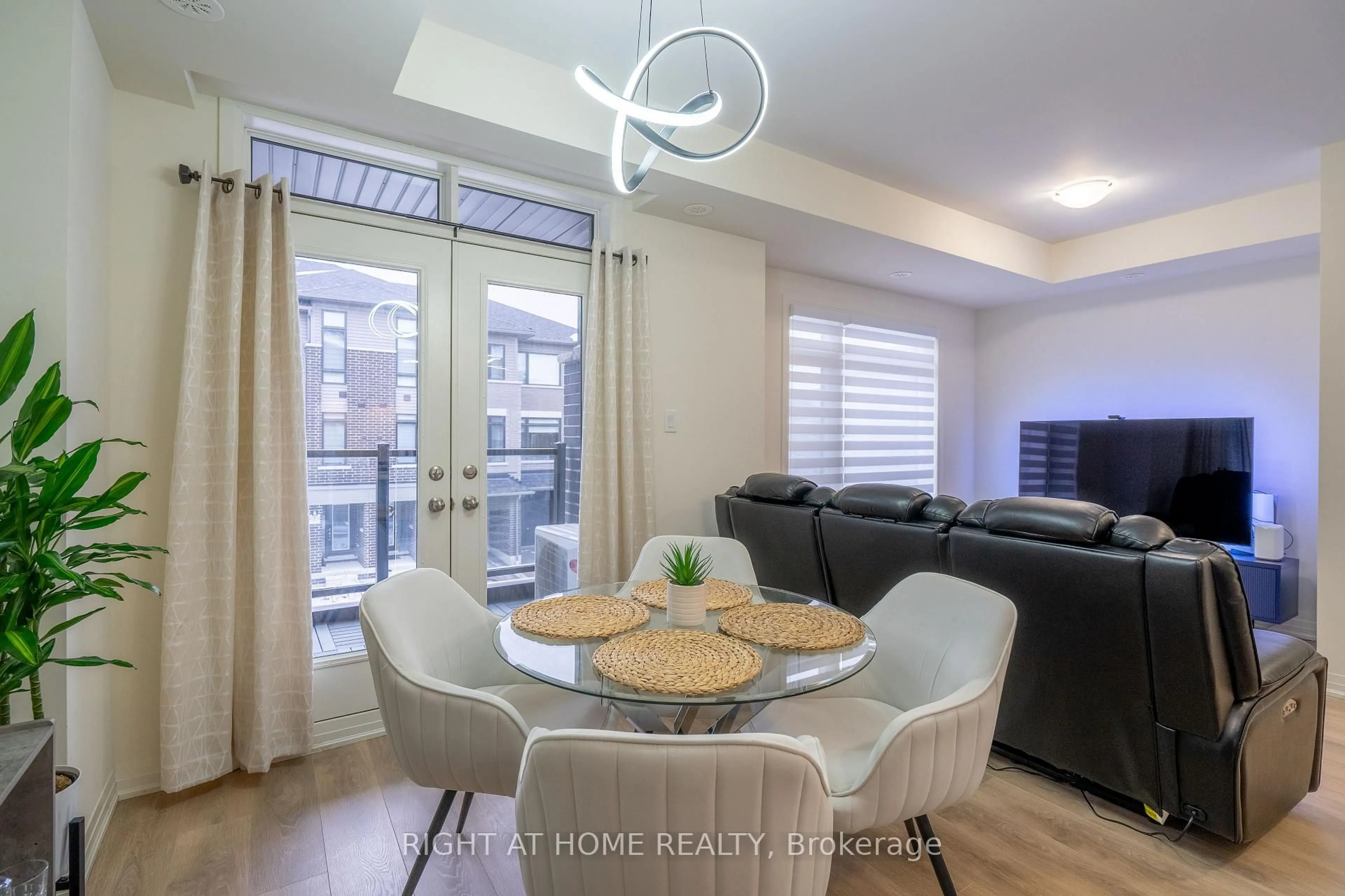 Living room with furniture, wood/laminate floor for 12 Emmas Way, Whitby Ontario L1R 0S7
