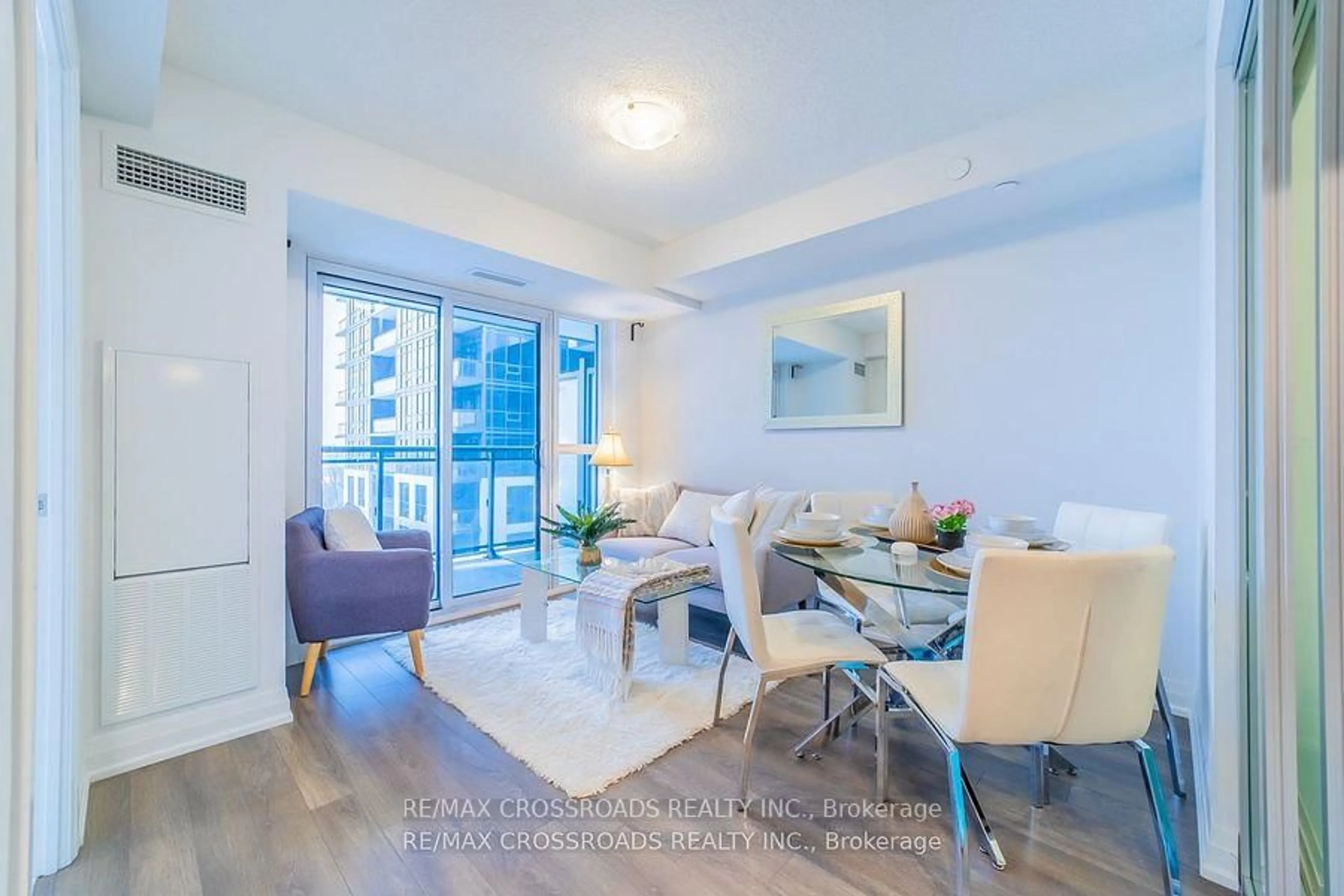 Living room with furniture, wood/laminate floor for 20 Meadowglen Pl #422, Toronto Ontario M1G 0A9