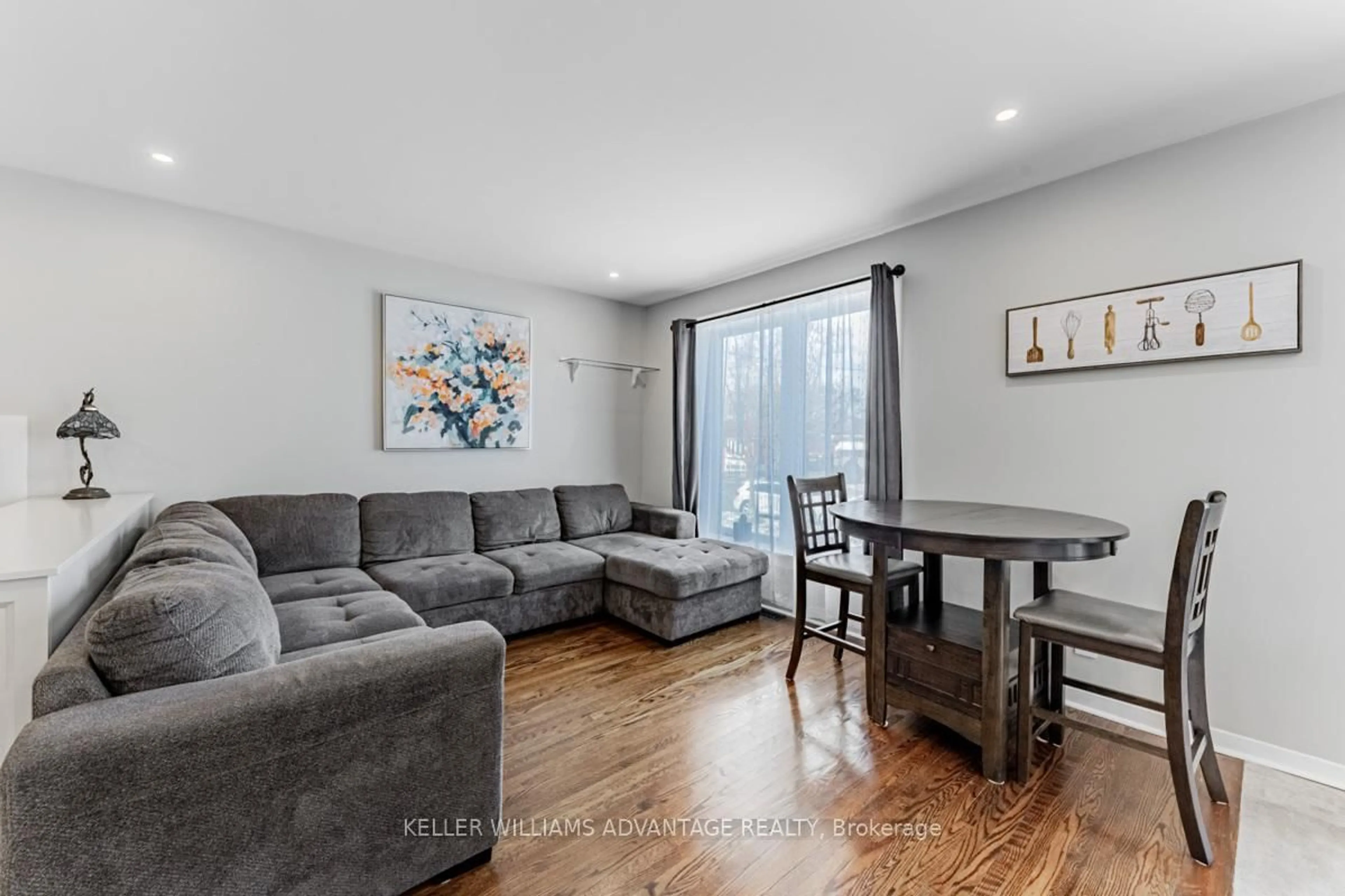 Living room with furniture, wood/laminate floor for 87 Merryfield Dr, Toronto Ontario M1P 1K3