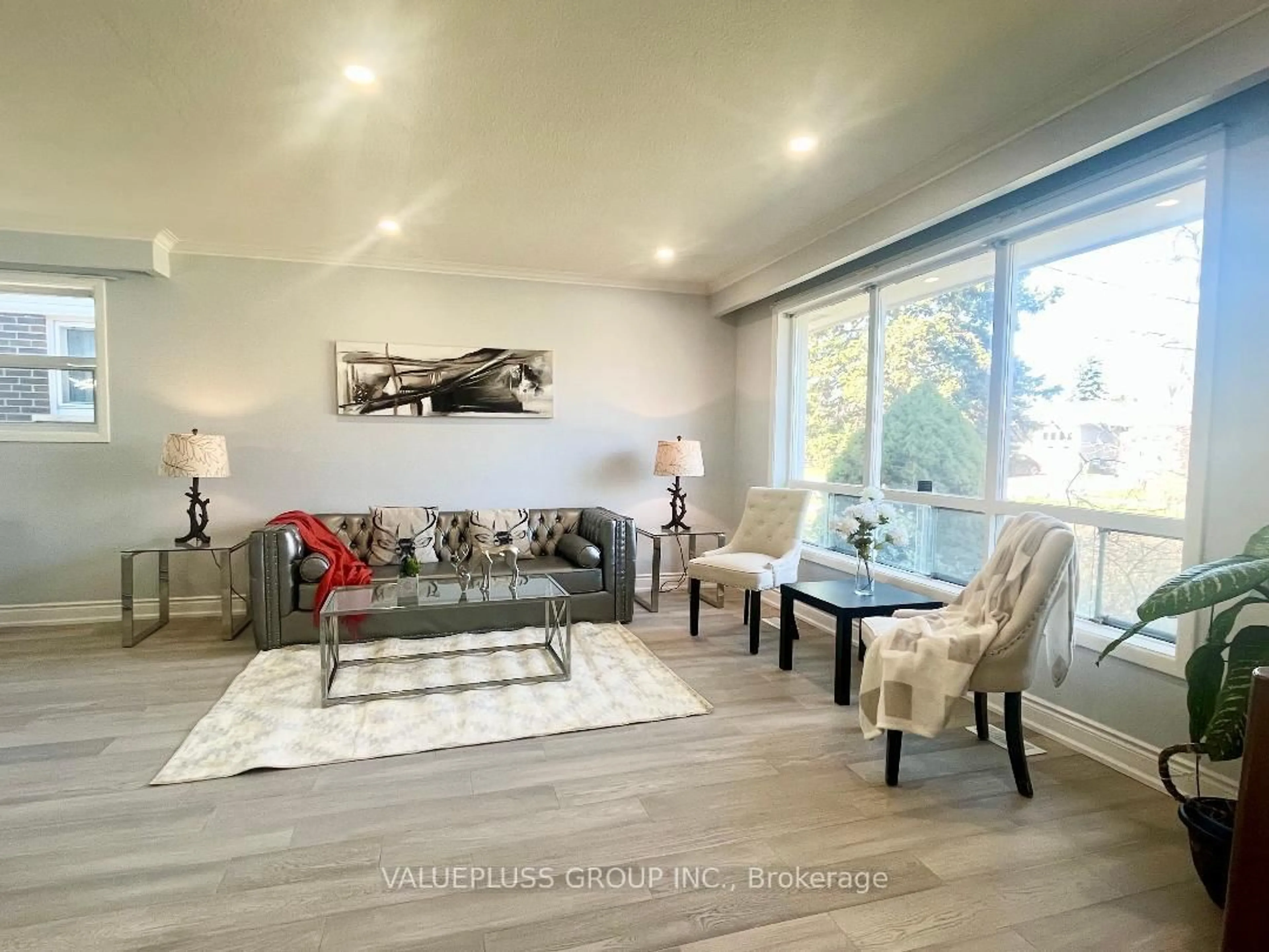 Living room with furniture, wood/laminate floor for 56 Moraine Hill Dr, Toronto Ontario M1T 2A2