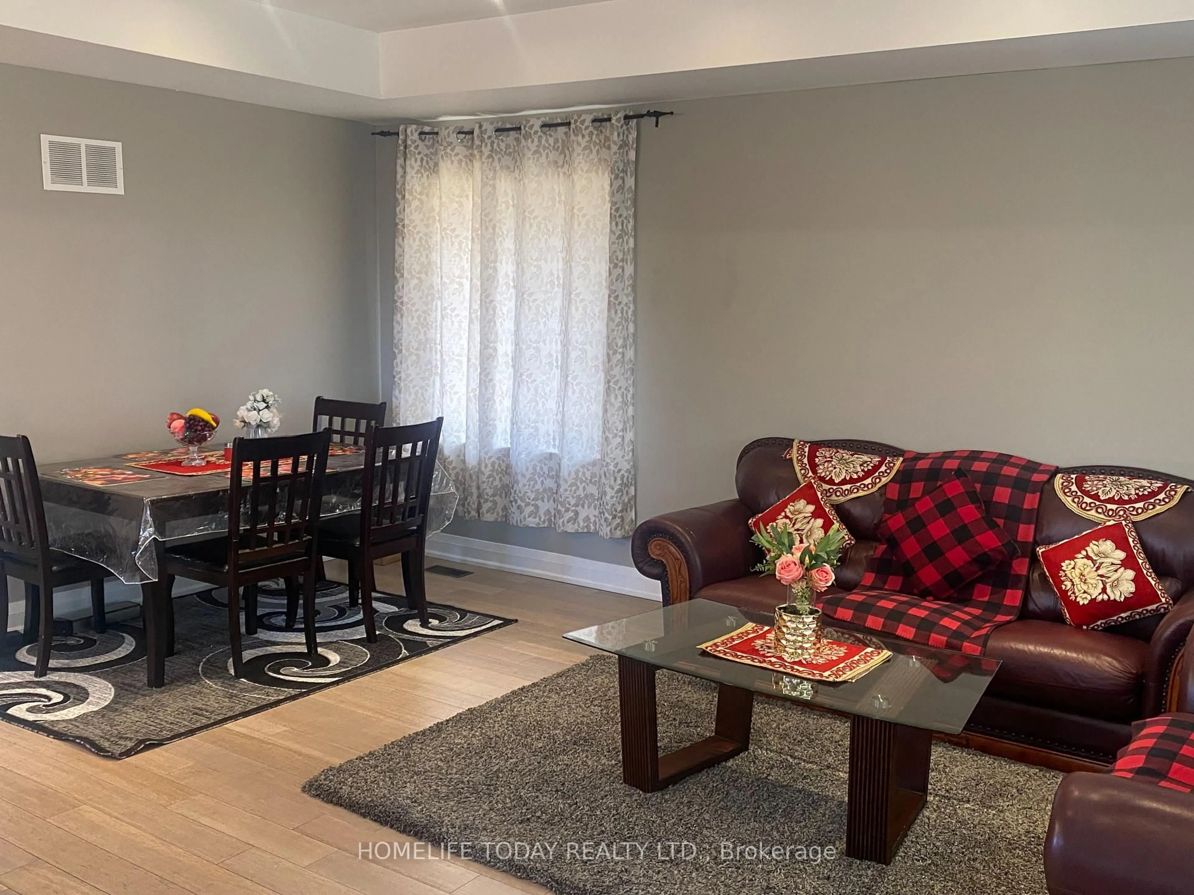 Living room with furniture, wood/laminate floor for 6 Greyabbey Tr, Toronto Ontario M1E 1V7