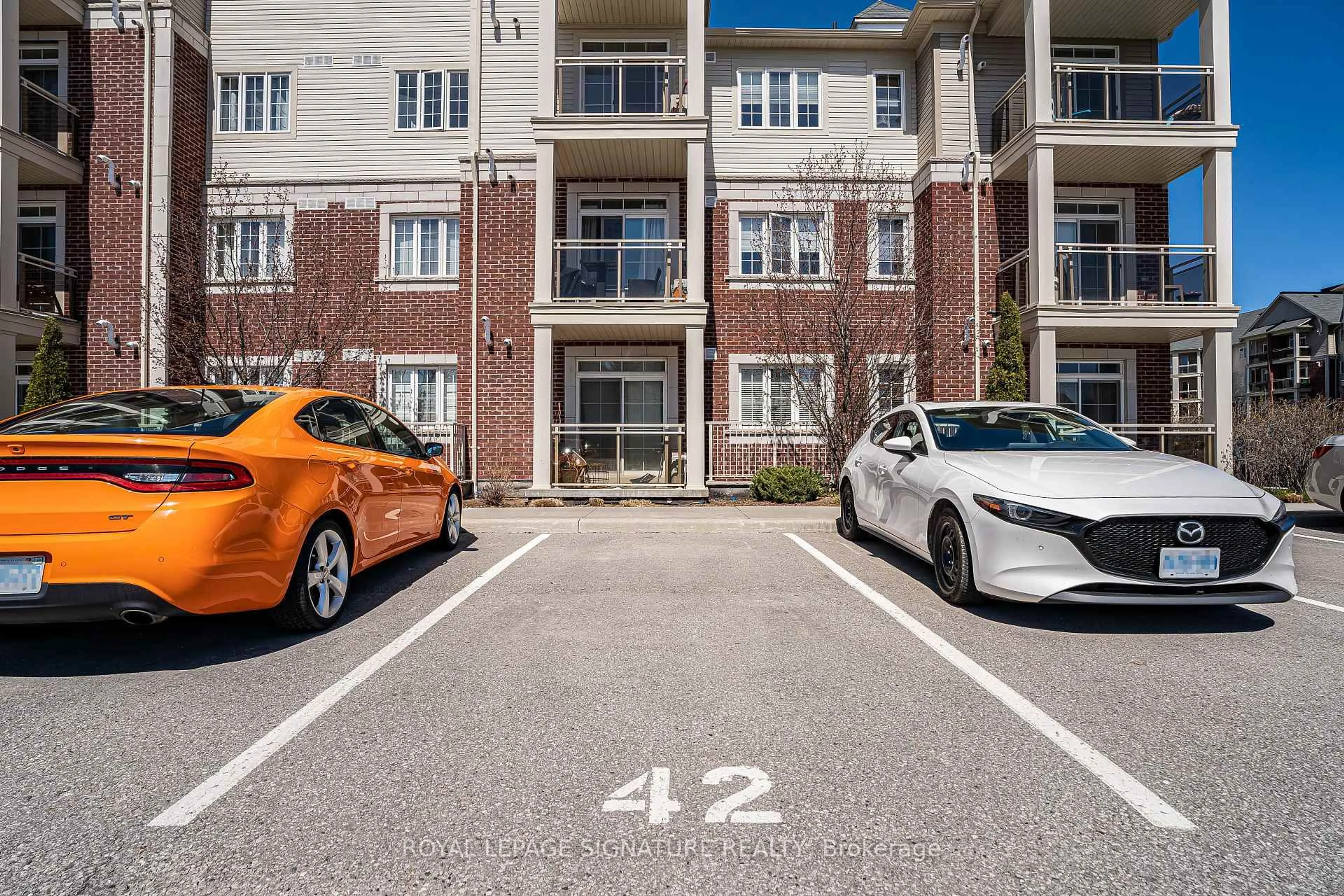 A pic from outside/outdoor area/front of a property/back of a property/a pic from drone, street for 84 Aspen Springs Dr #227, Clarington Ontario L1C 0V3