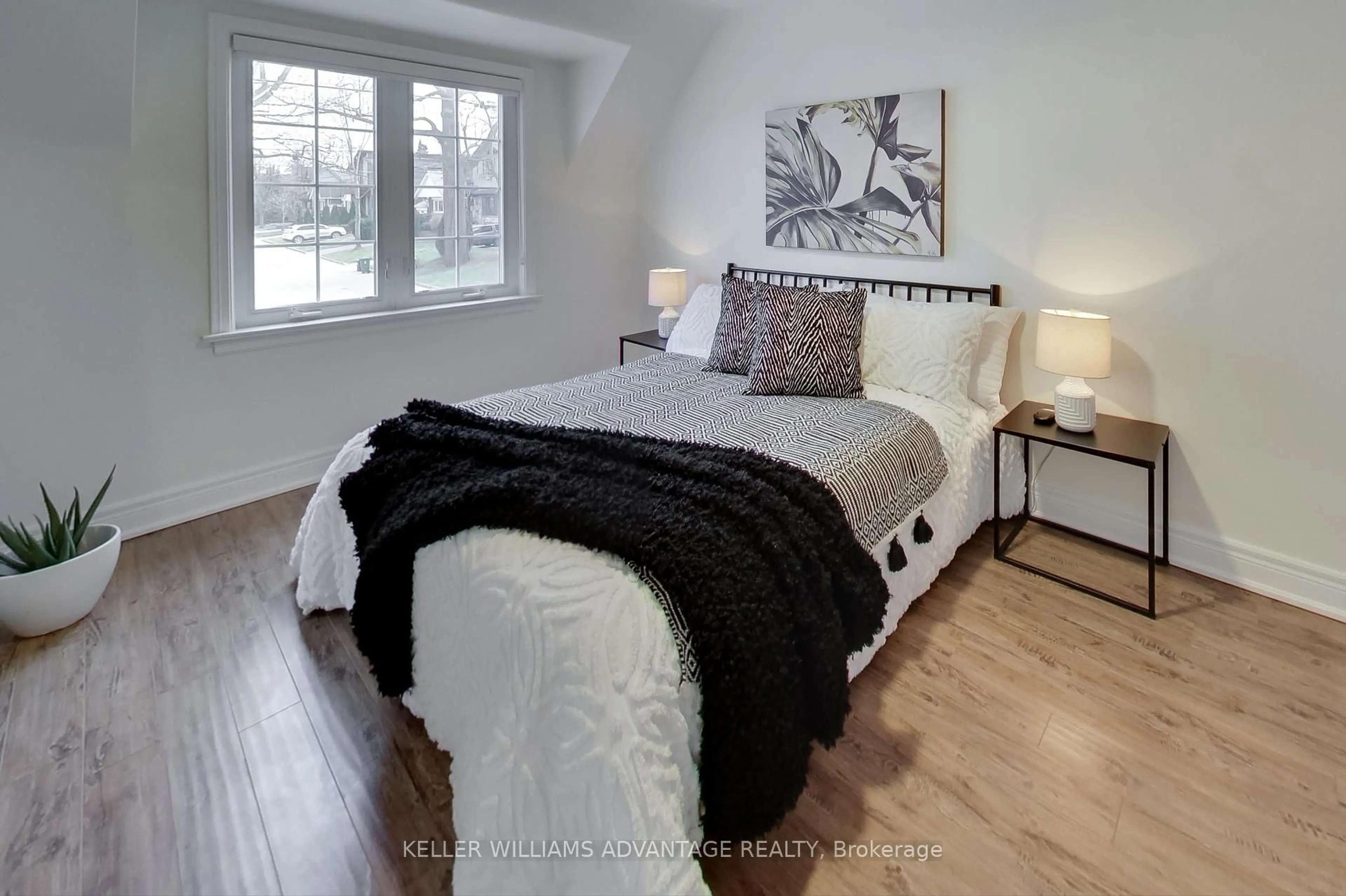 Bedroom with bed, wood/laminate floor for 12 Parkland Rd, Toronto Ontario M1N 1Y5