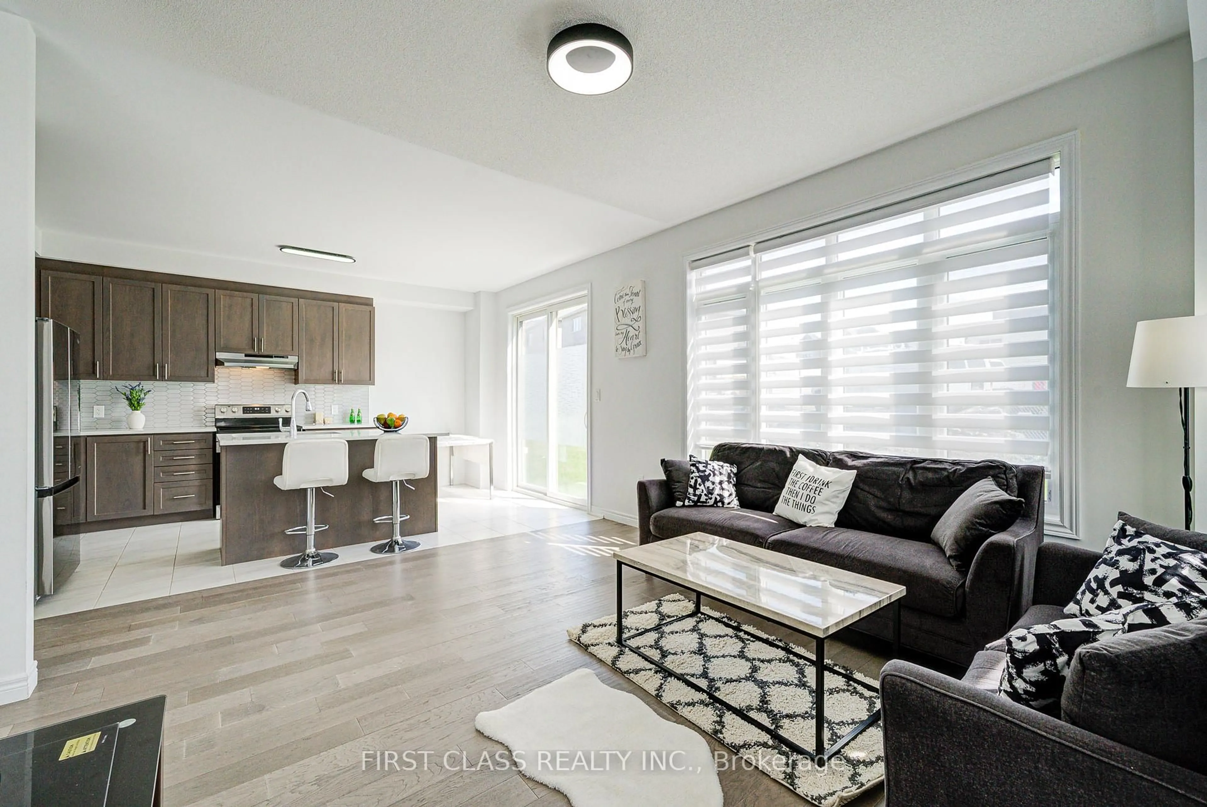 Living room with furniture, wood/laminate floor for 2049 Chris Mason St, Oshawa Ontario L1H 7K5