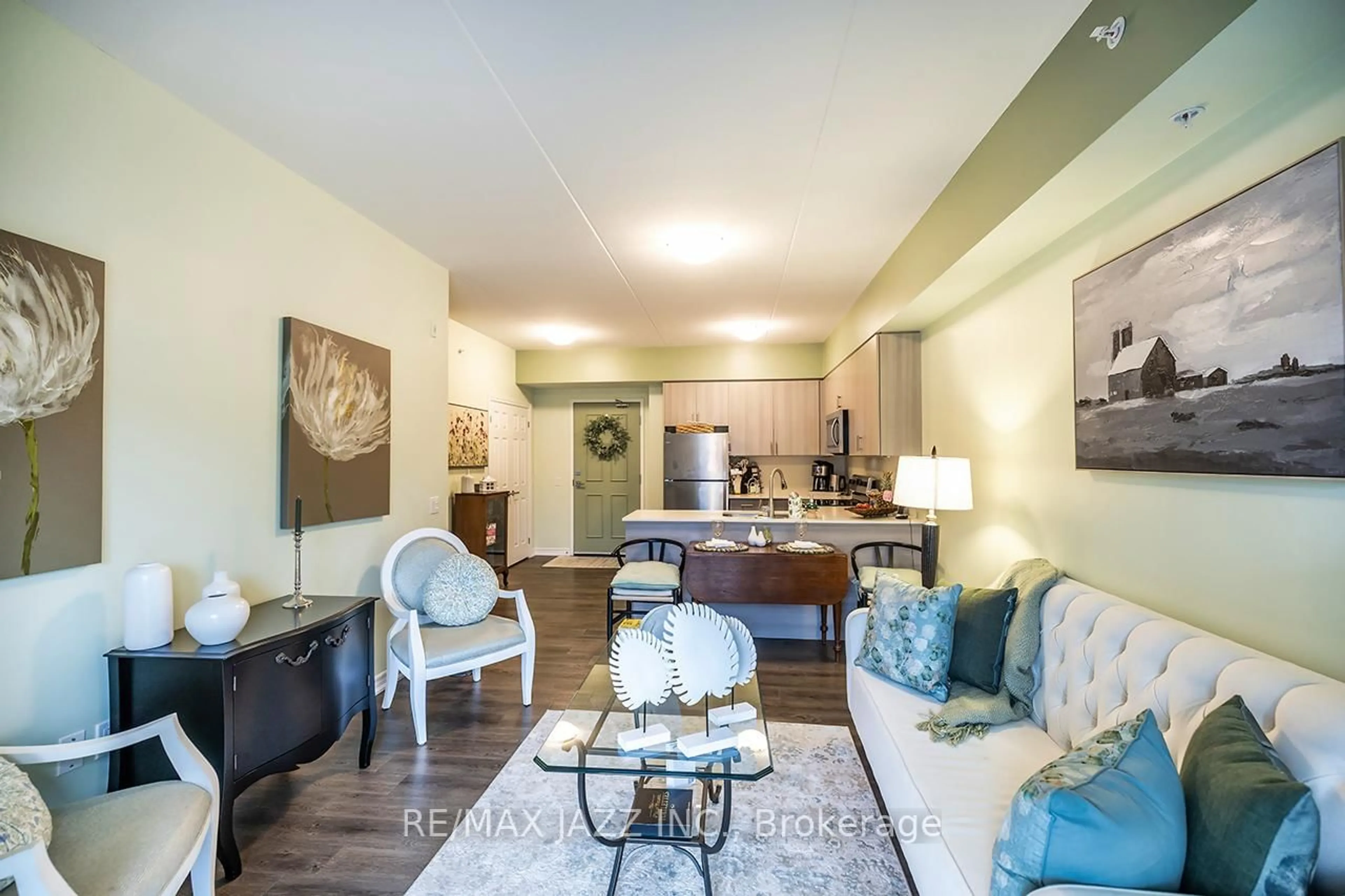 Living room with furniture, wood/laminate floor for 290 Liberty St #103, Clarington Ontario L1C 0H3