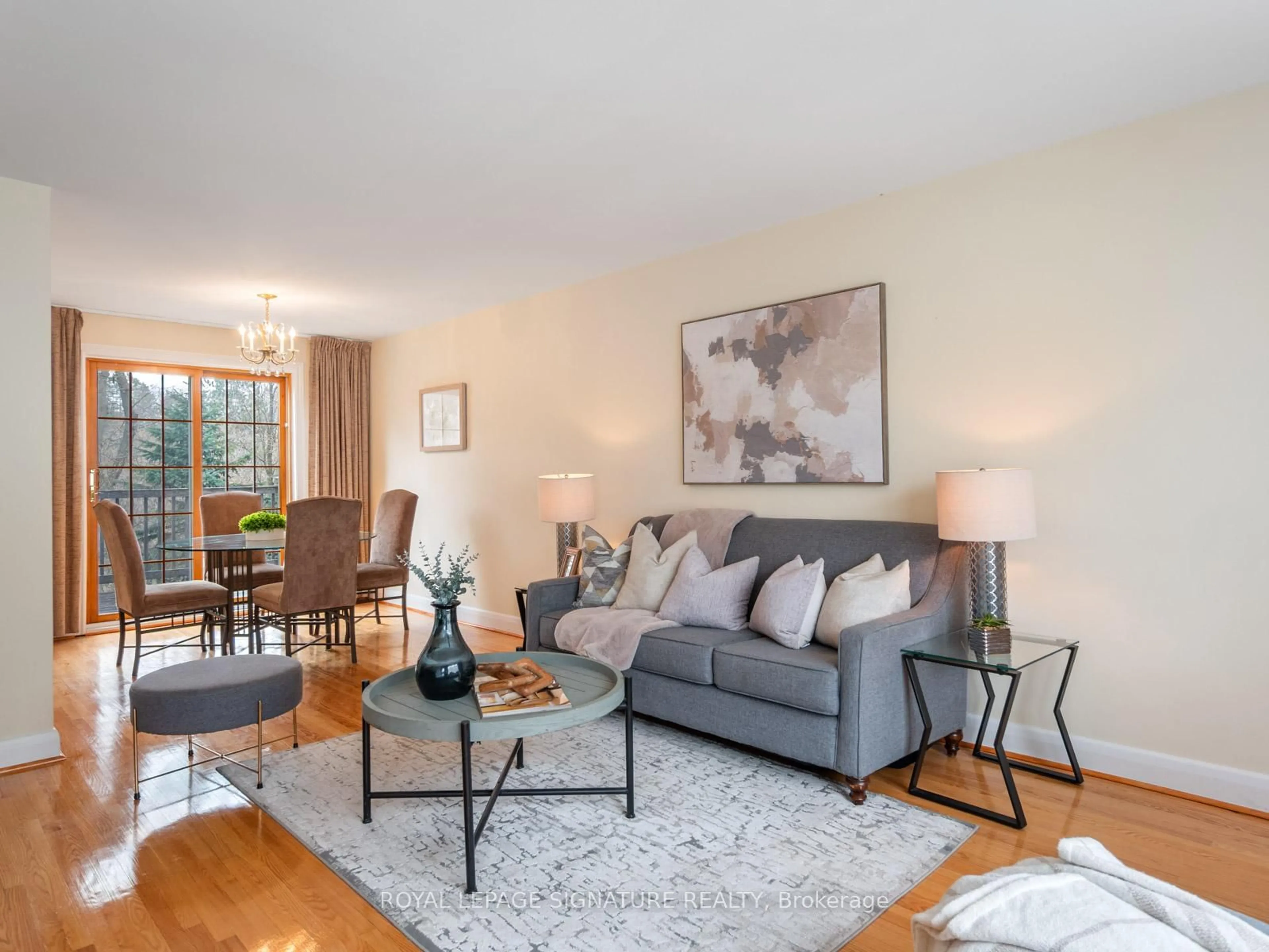 Living room with furniture, wood/laminate floor for 7 Notley Pl, Toronto Ontario M4B 2M7