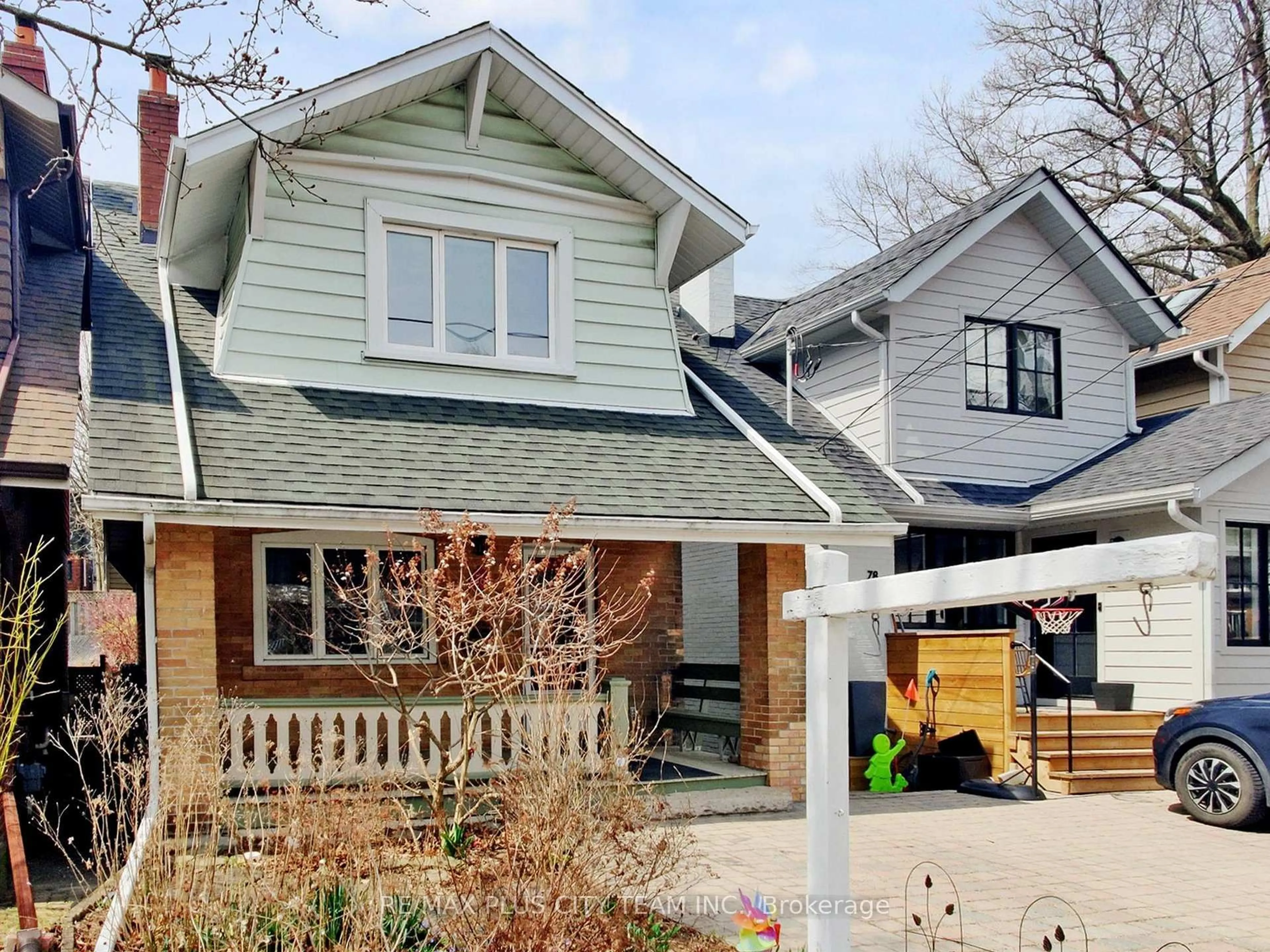 Home with brick exterior material, street for 76 Brookside Dr, Toronto Ontario M4E 2M1