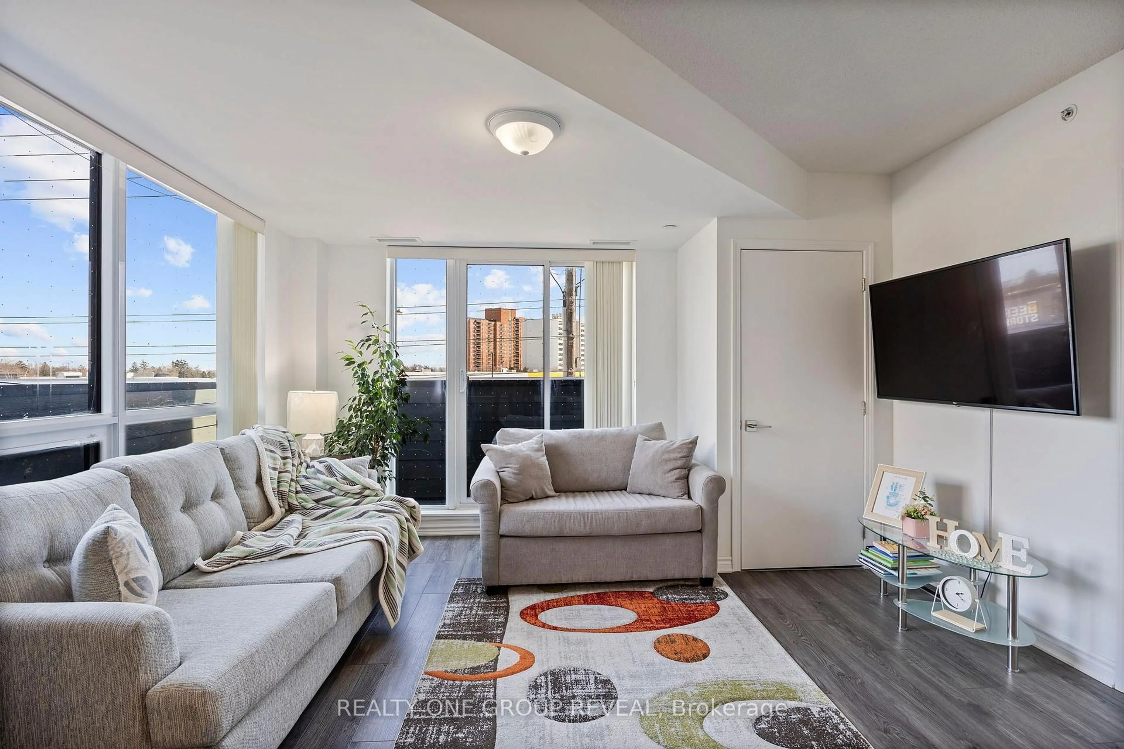Living room with furniture, unknown for 1 Falaise Rd #313, Toronto Ontario M1E 0B9
