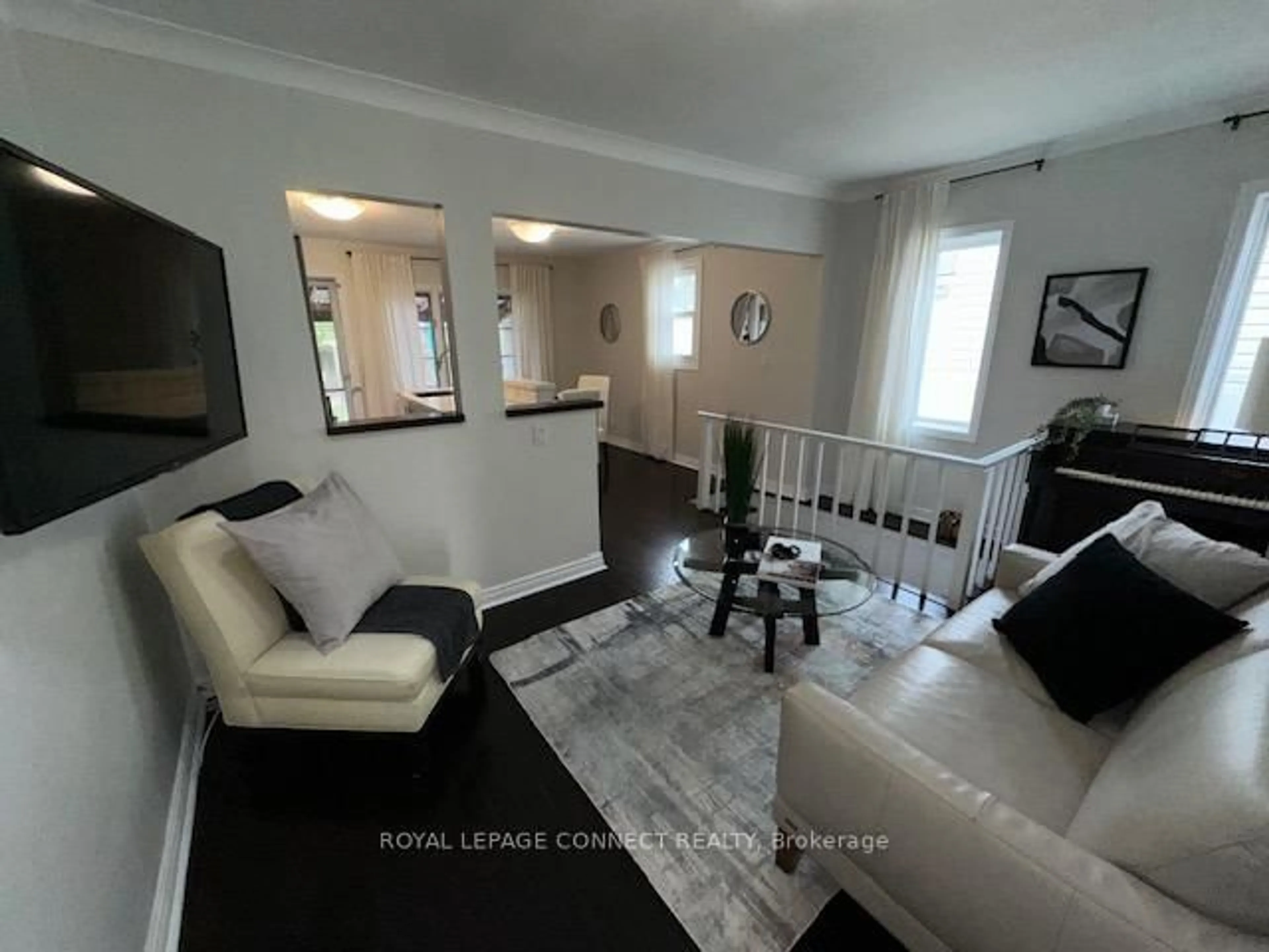 Living room with furniture, wood/laminate floor for 242 Gledhill Ave, Toronto Ontario M4C 5L2