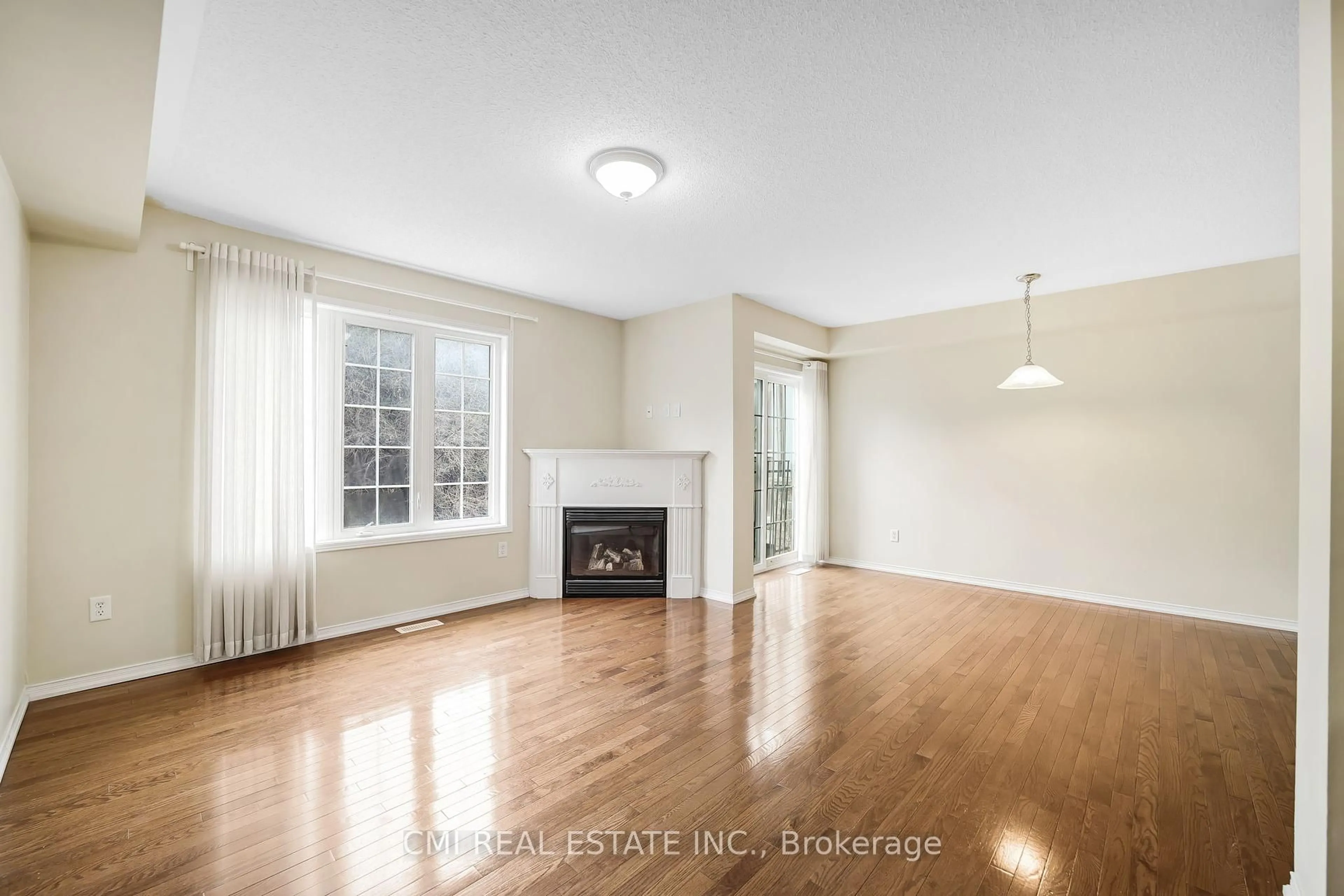 Living room with furniture, wood/laminate floor for 9 Tempo Way, Whitby Ontario L1M 1B3
