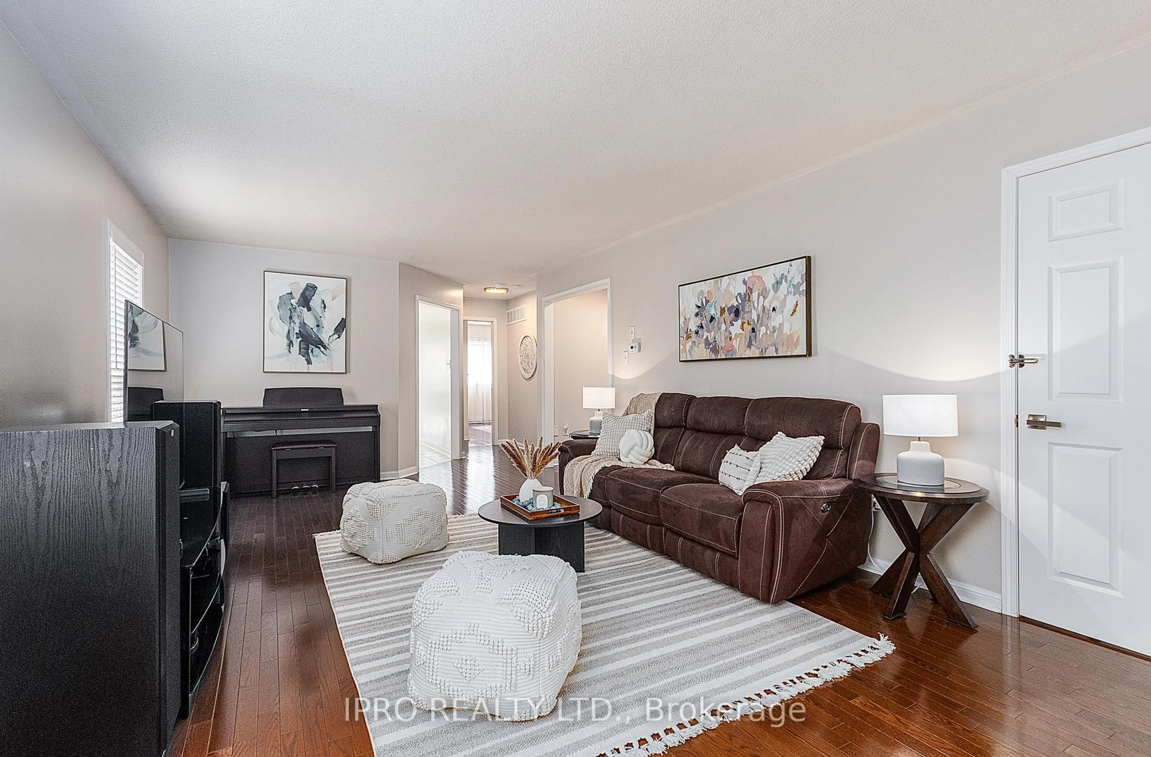 Living room with furniture, wood/laminate floor for 15 Juneau Cres, Whitby Ontario L1R 3A1