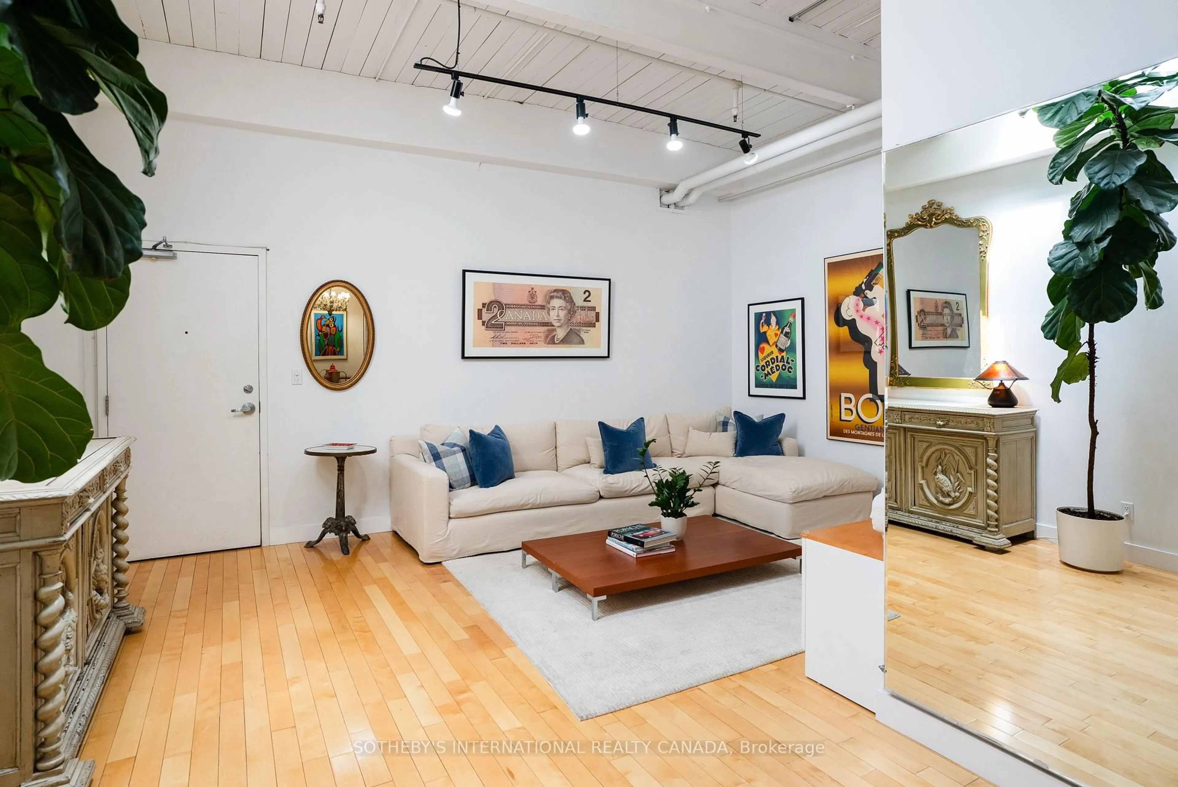 Living room with furniture, wood/laminate floor for 326 Carlaw Ave #233, Toronto Ontario M4M 3N8