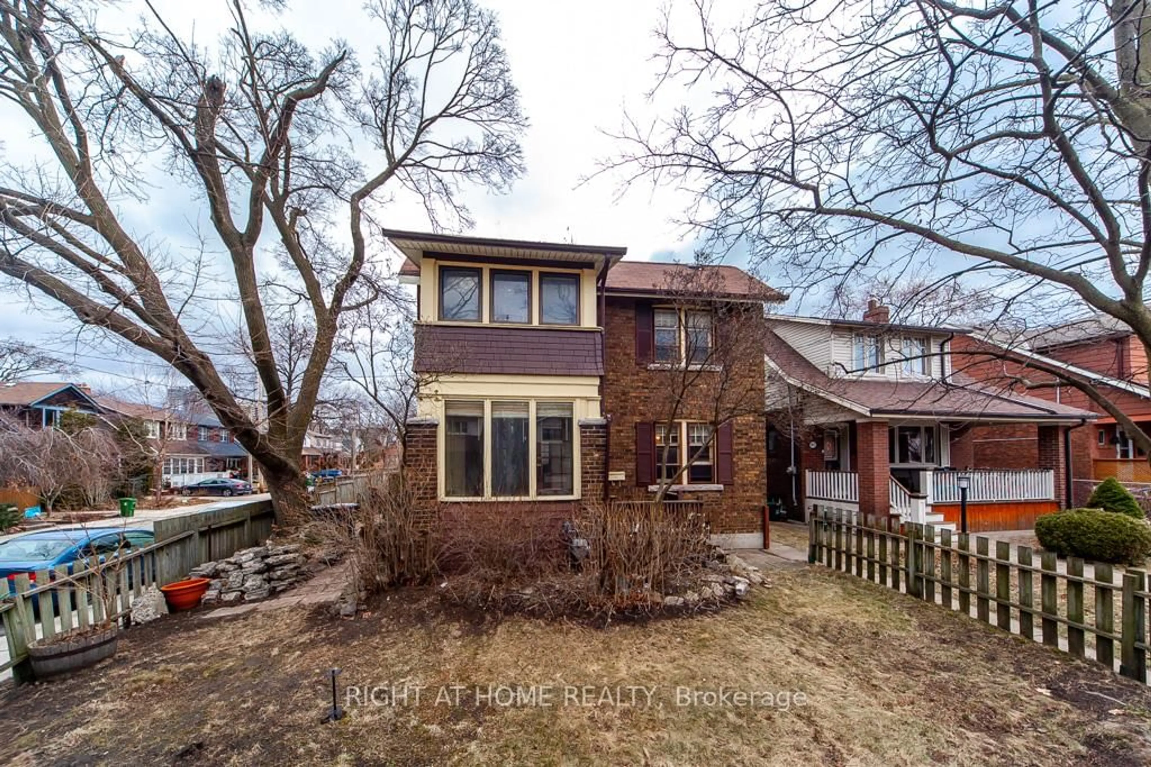 Home with brick exterior material, street for 209 Brookside Dr, Toronto Ontario M4E 2M7
