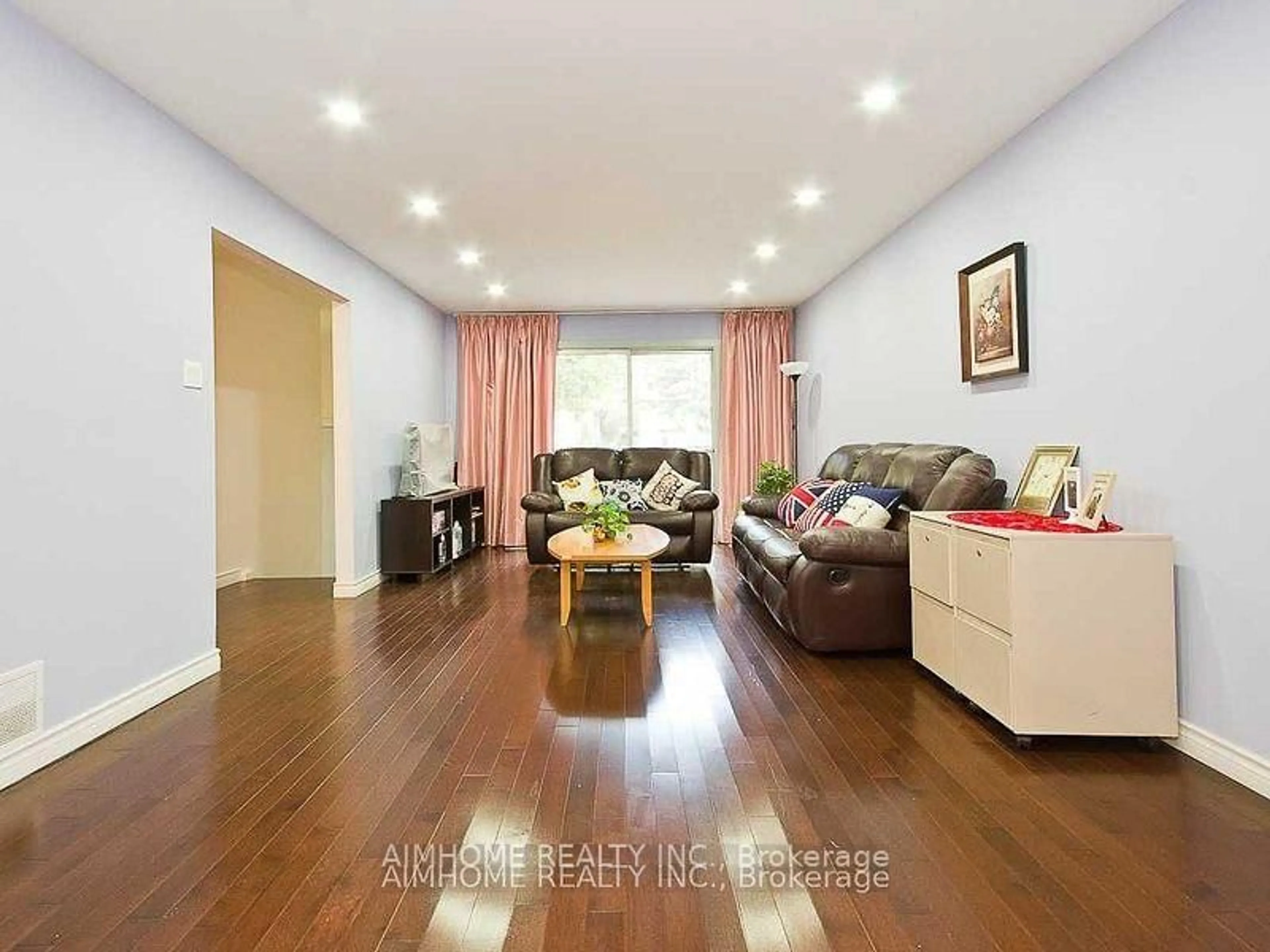 Living room with furniture, wood/laminate floor for 105 Crockamhill Dr, Toronto Ontario M1S 2L2