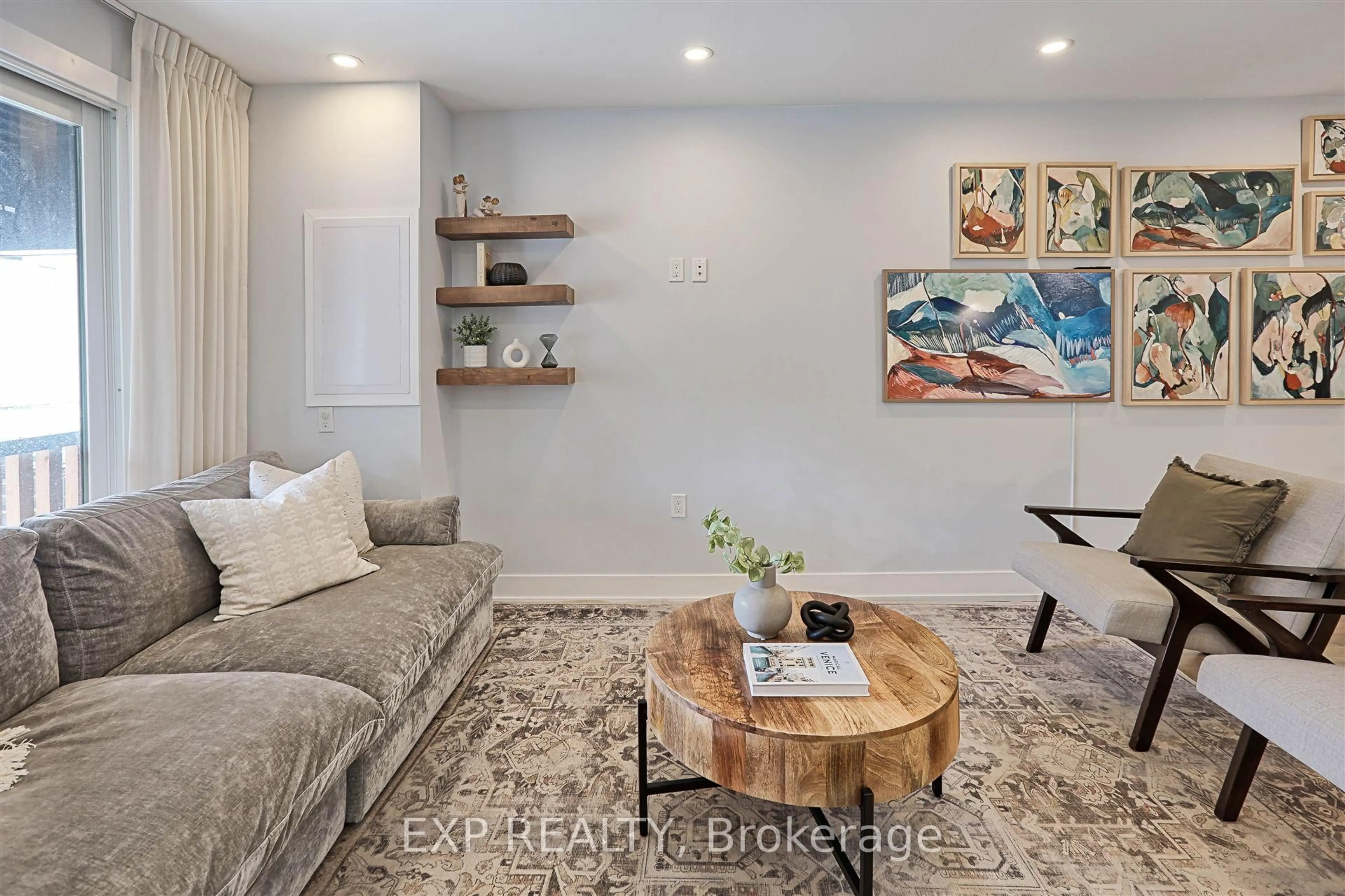 Living room with furniture, wood/laminate floor for 66 Marlow Ave, Toronto Ontario M4J 3V1