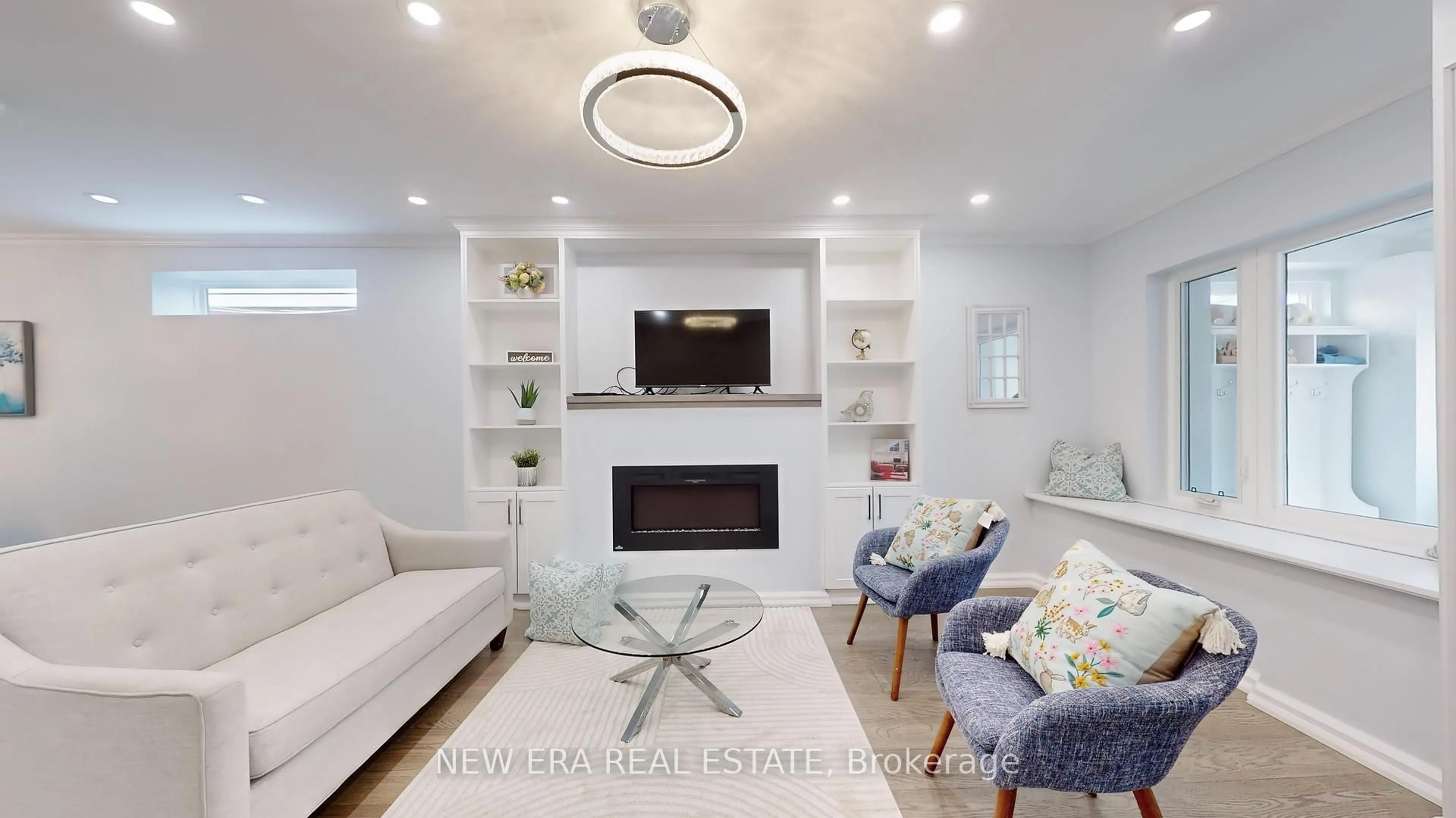 Living room with furniture, wood/laminate floor for 34 Kimbourne Ave, Toronto Ontario M4J 4J2
