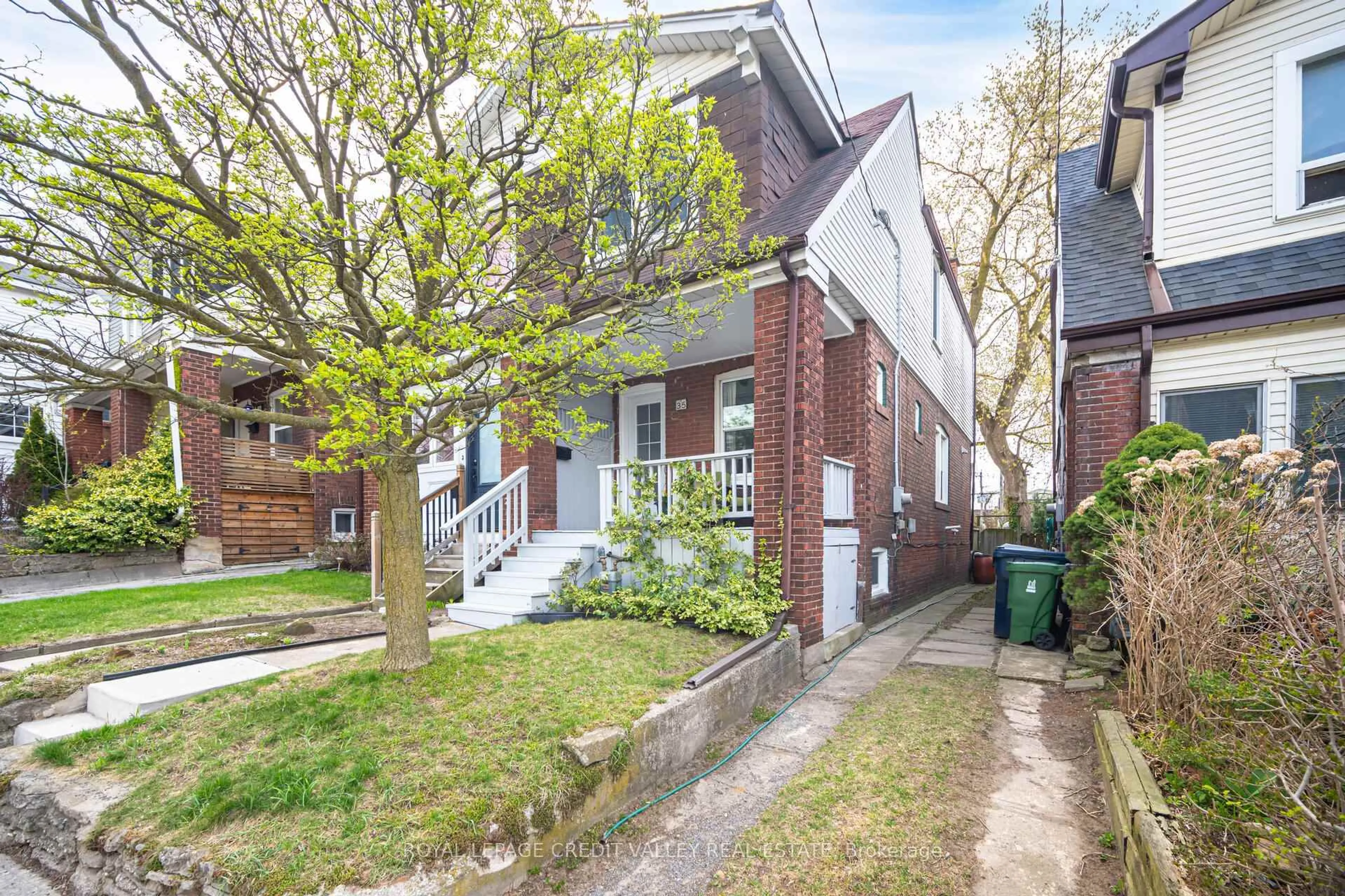 Home with brick exterior material, street for 35 Darrell Ave, Toronto Ontario M4E 2G5