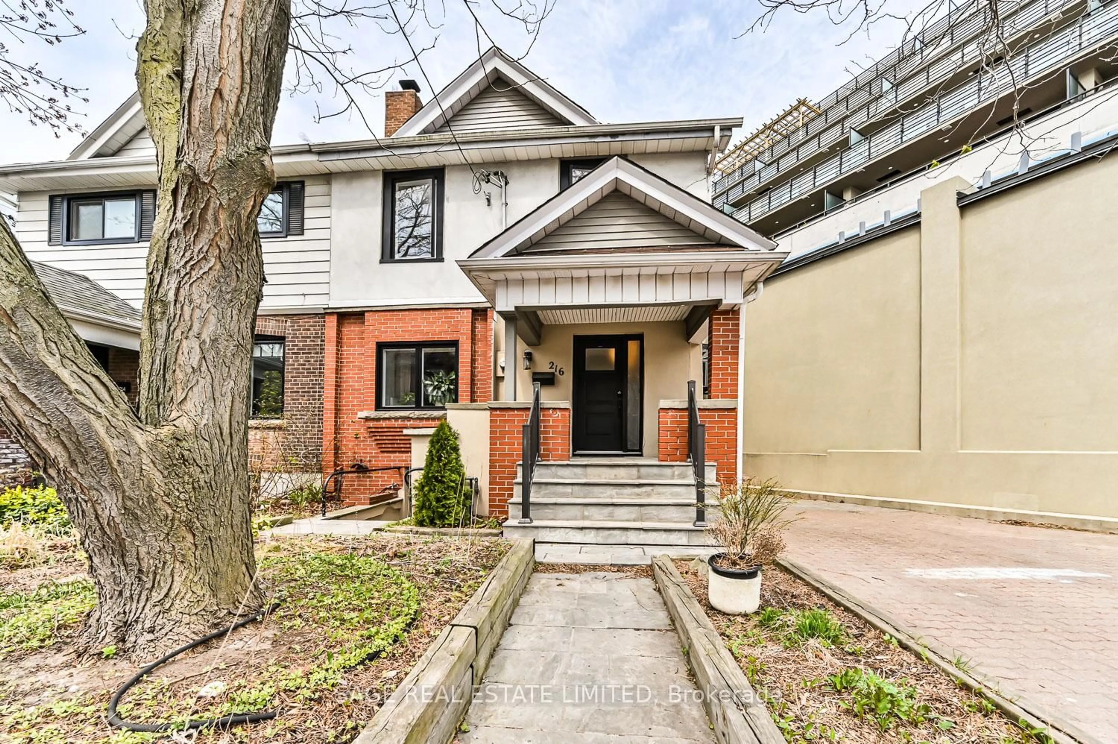 Home with brick exterior material, street for 216 Balsam Ave, Toronto Ontario M4E 3C5