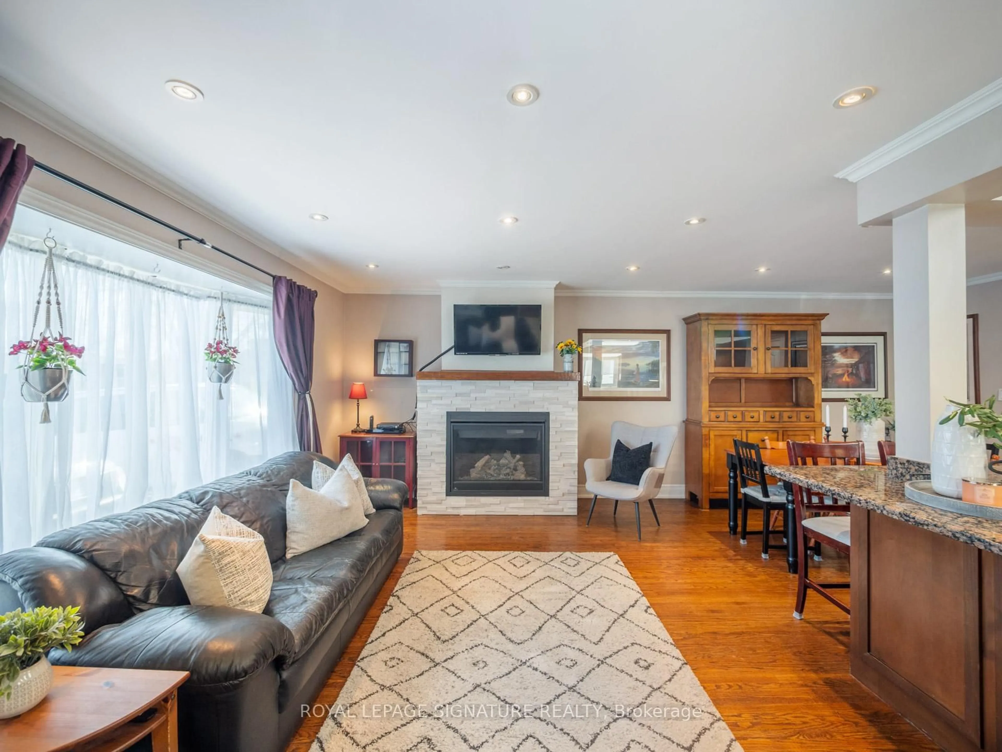 Living room with furniture, wood/laminate floor for 22 Tweedrock Cres, Toronto Ontario M1E 4L5