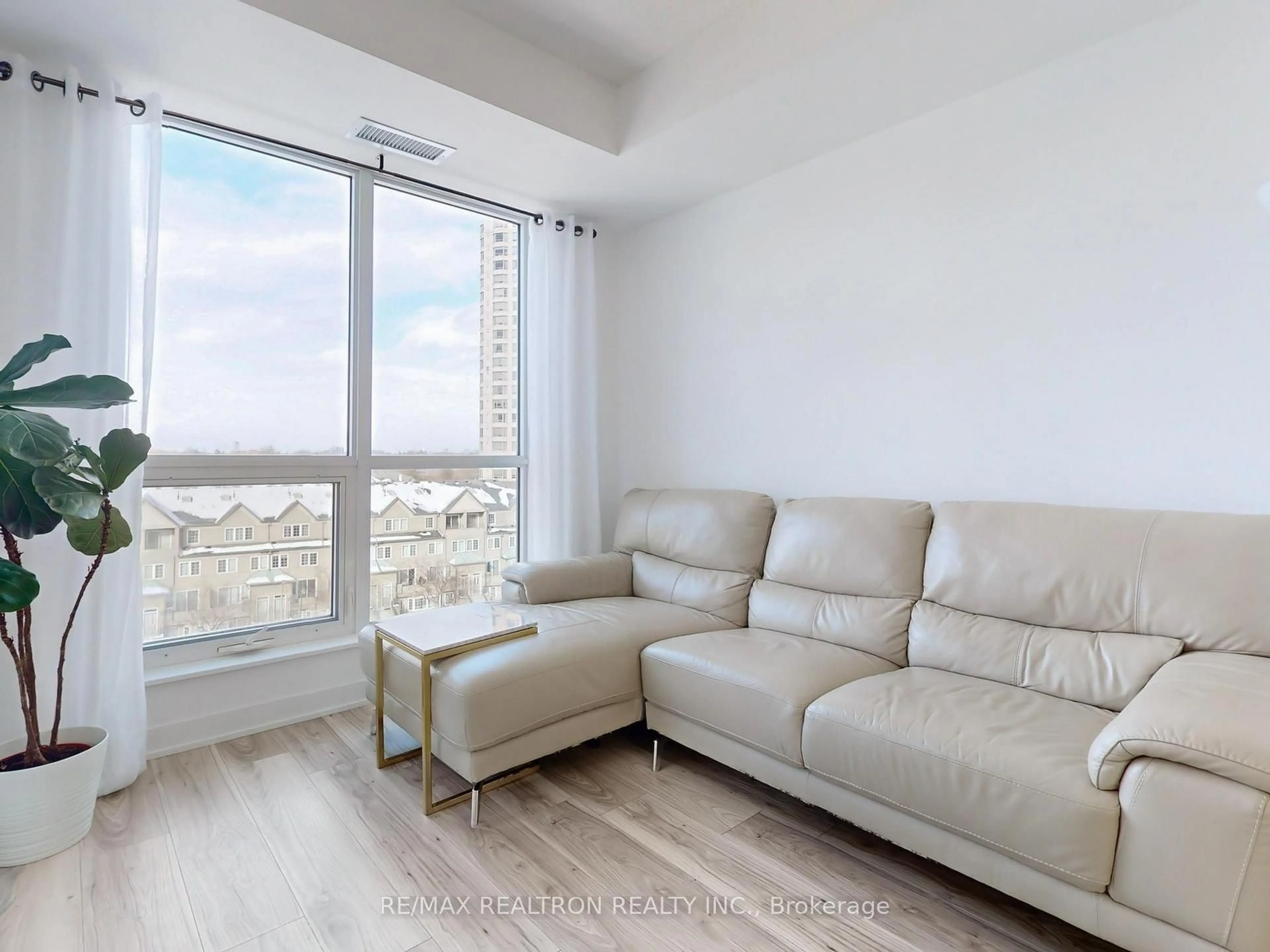 Living room with furniture, wood/laminate floor for 195 Bonis Ave #603, Toronto Ontario M1T 0A5