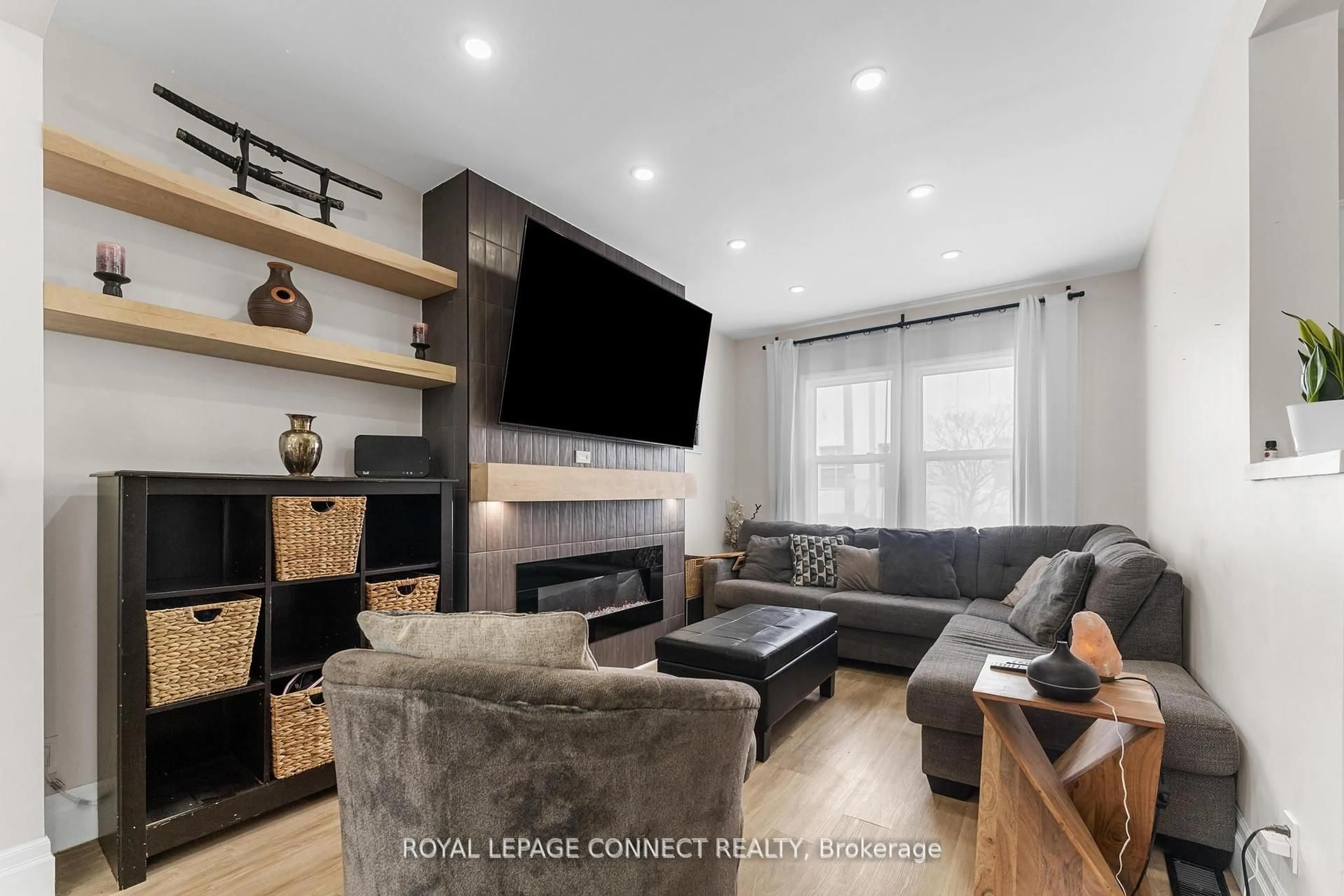 Living room with furniture, wood/laminate floor for 95 Richmond St, Oshawa Ontario L1G 1E3