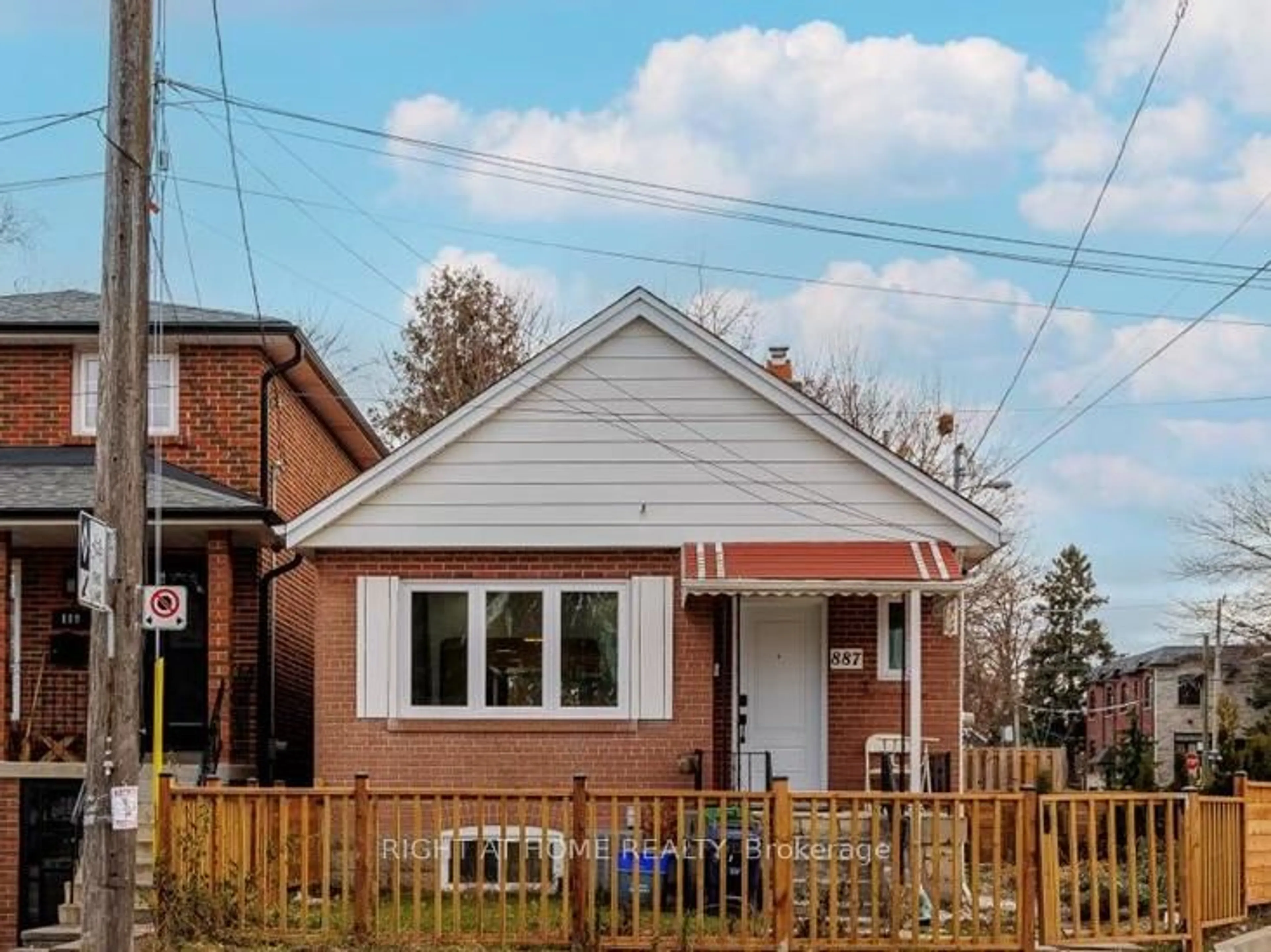 Home with brick exterior material, street for 887 Cosburn Ave, Toronto Ontario M4C 2W5