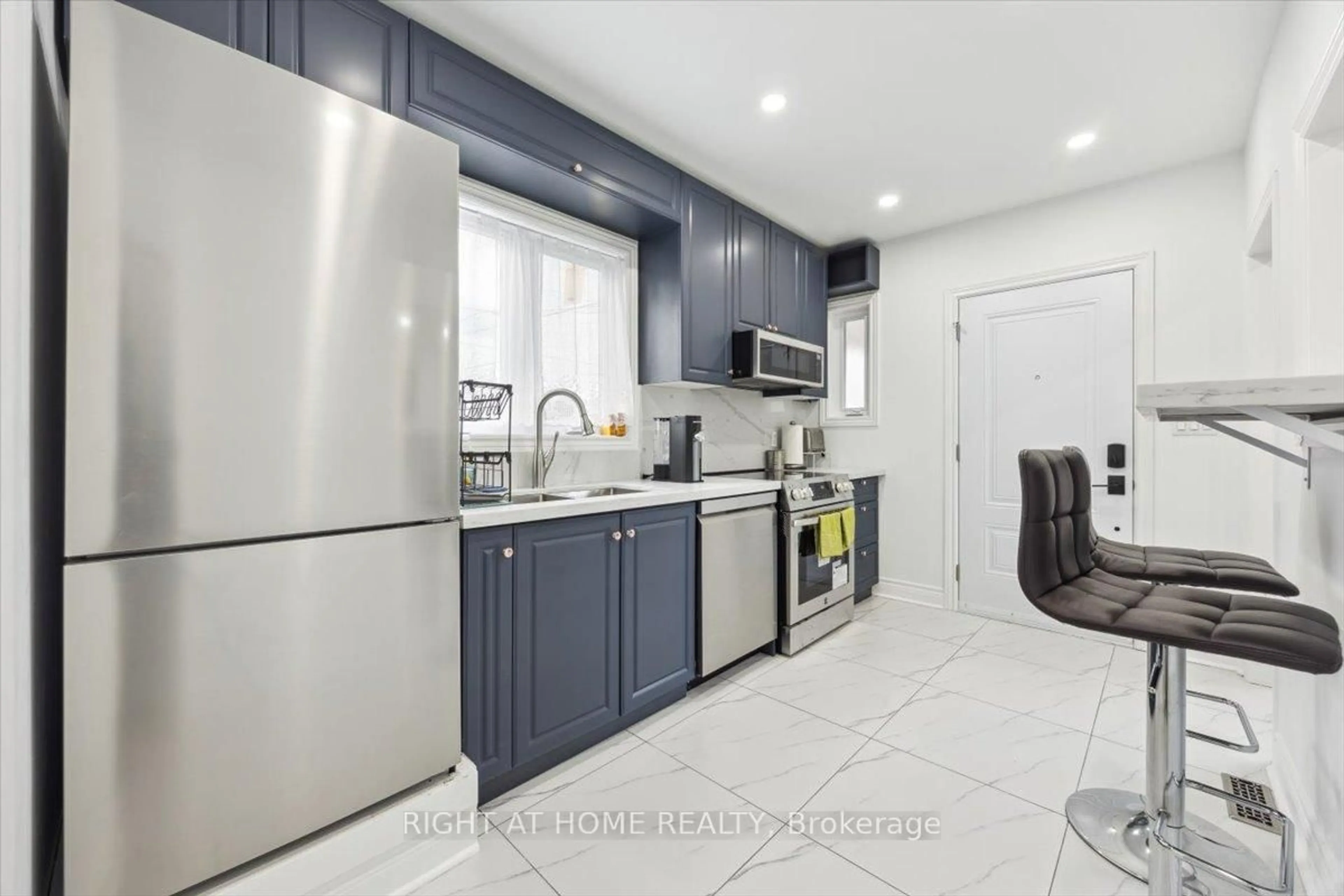 Open concept kitchen, ceramic/tile floor for 887 Cosburn Ave, Toronto Ontario M4C 2W5