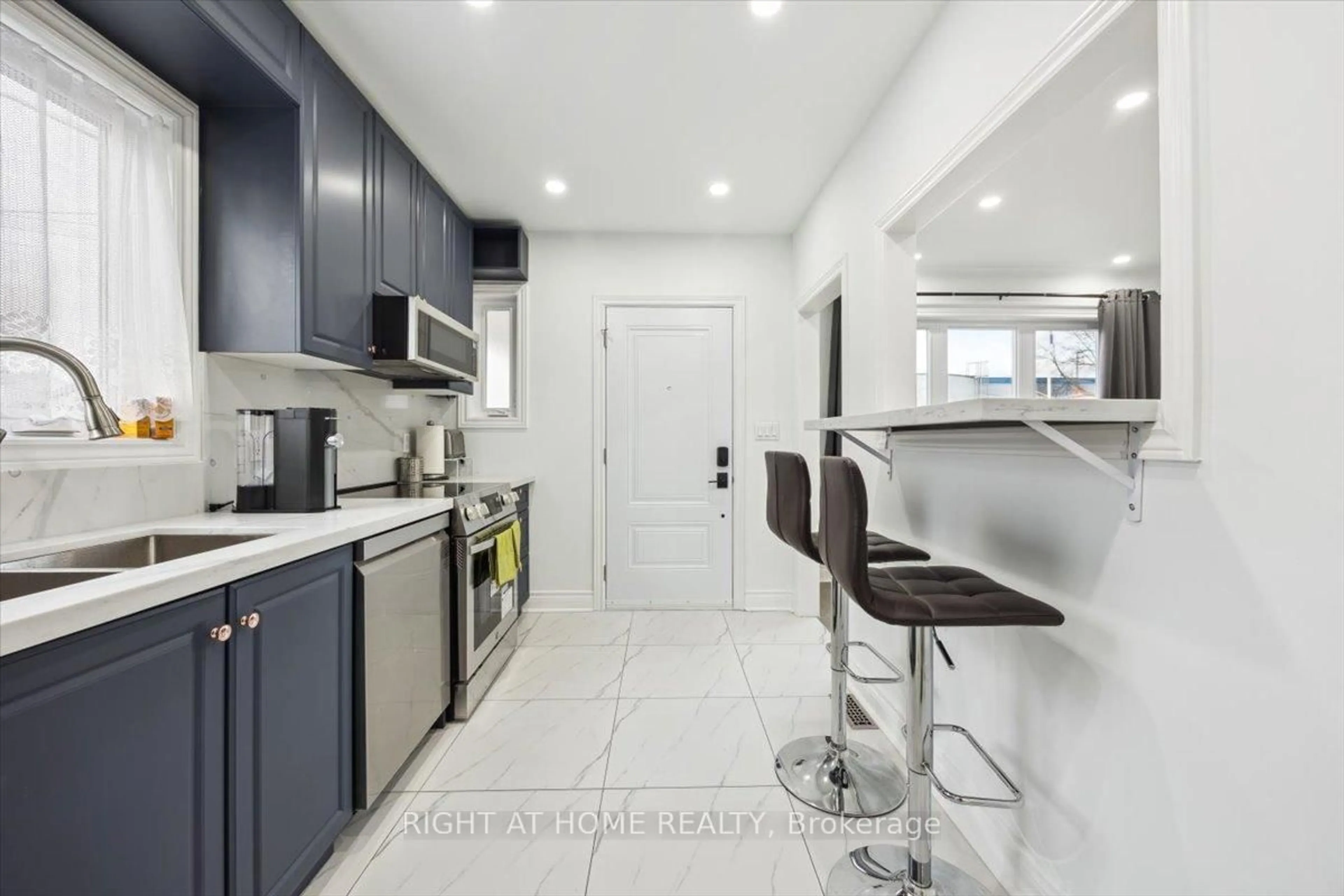 Contemporary kitchen, ceramic/tile floor for 887 Cosburn Ave, Toronto Ontario M4C 2W5