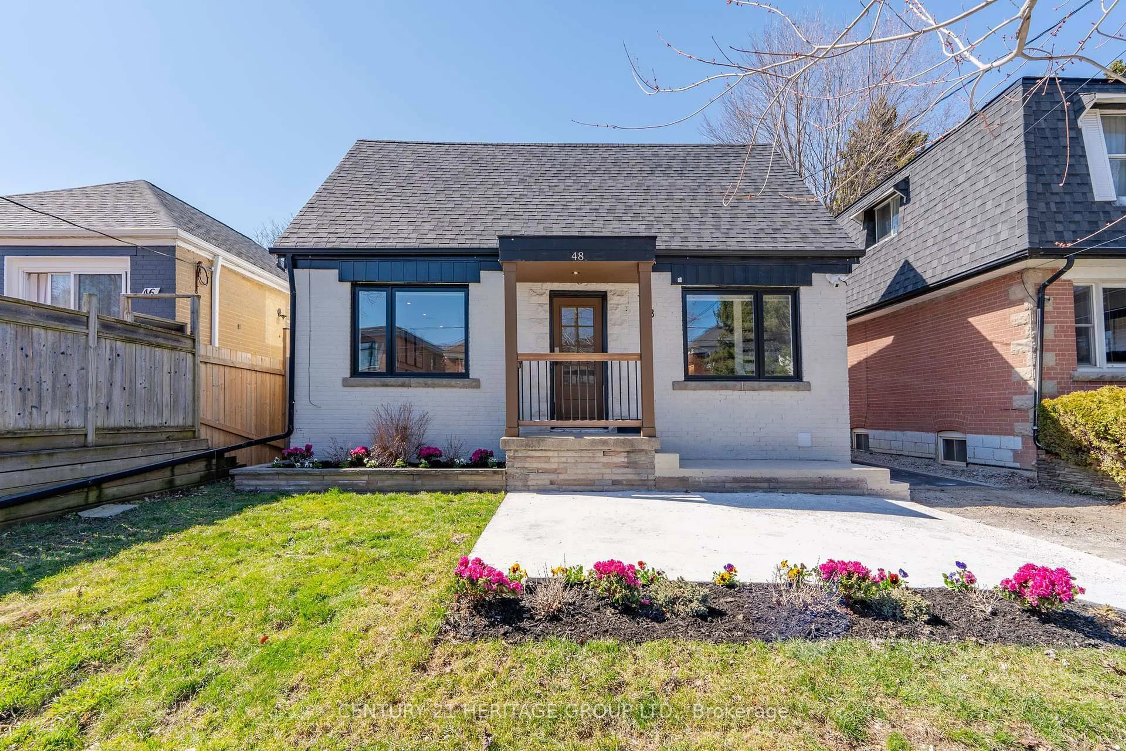 Home with brick exterior material, street for 48 DENVALE Rd, Toronto Ontario M4B 3B7