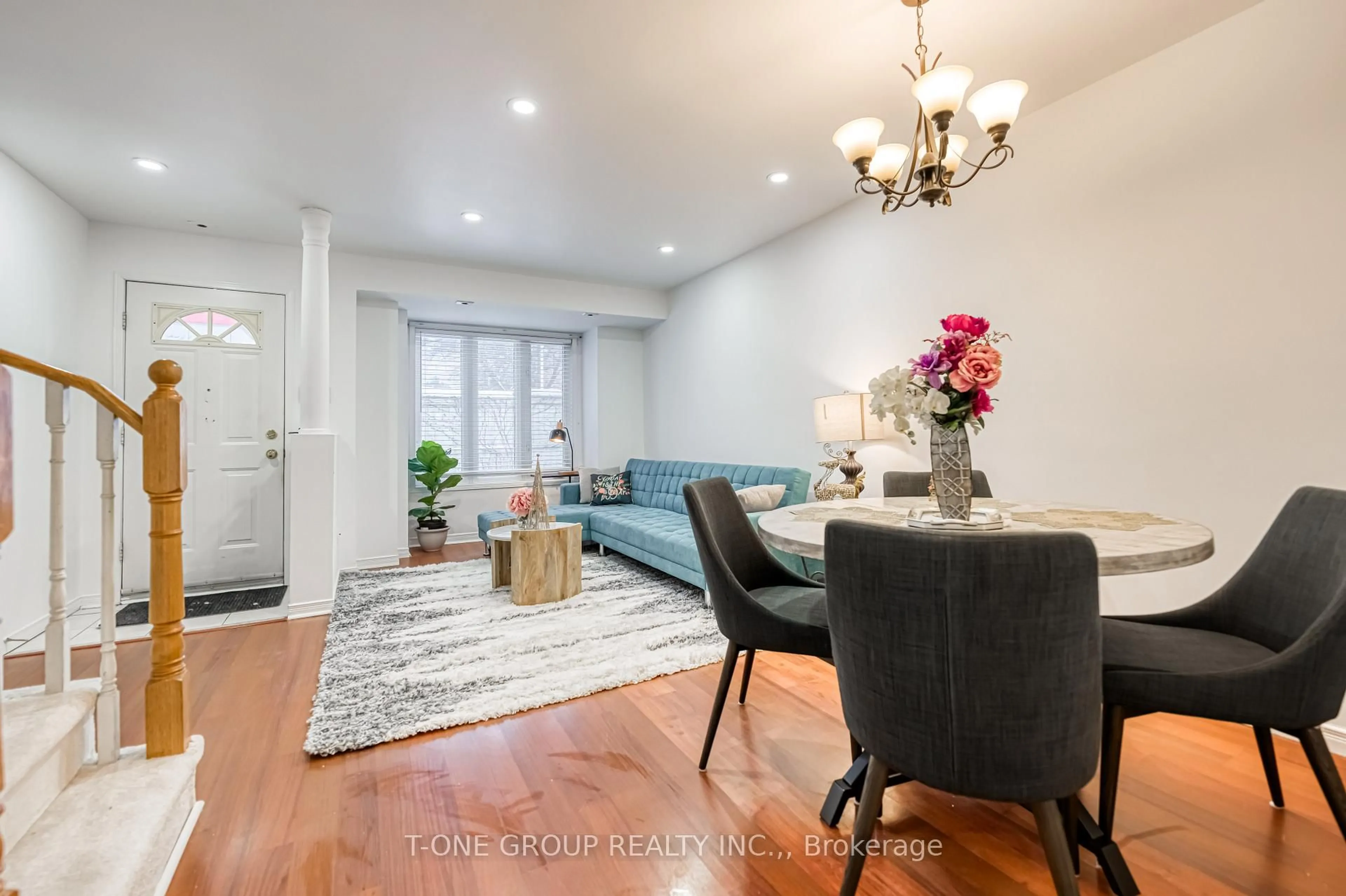 Living room with furniture, wood/laminate floor for 19 Rosebank Dr #903, Toronto Ontario M1B 5Z2