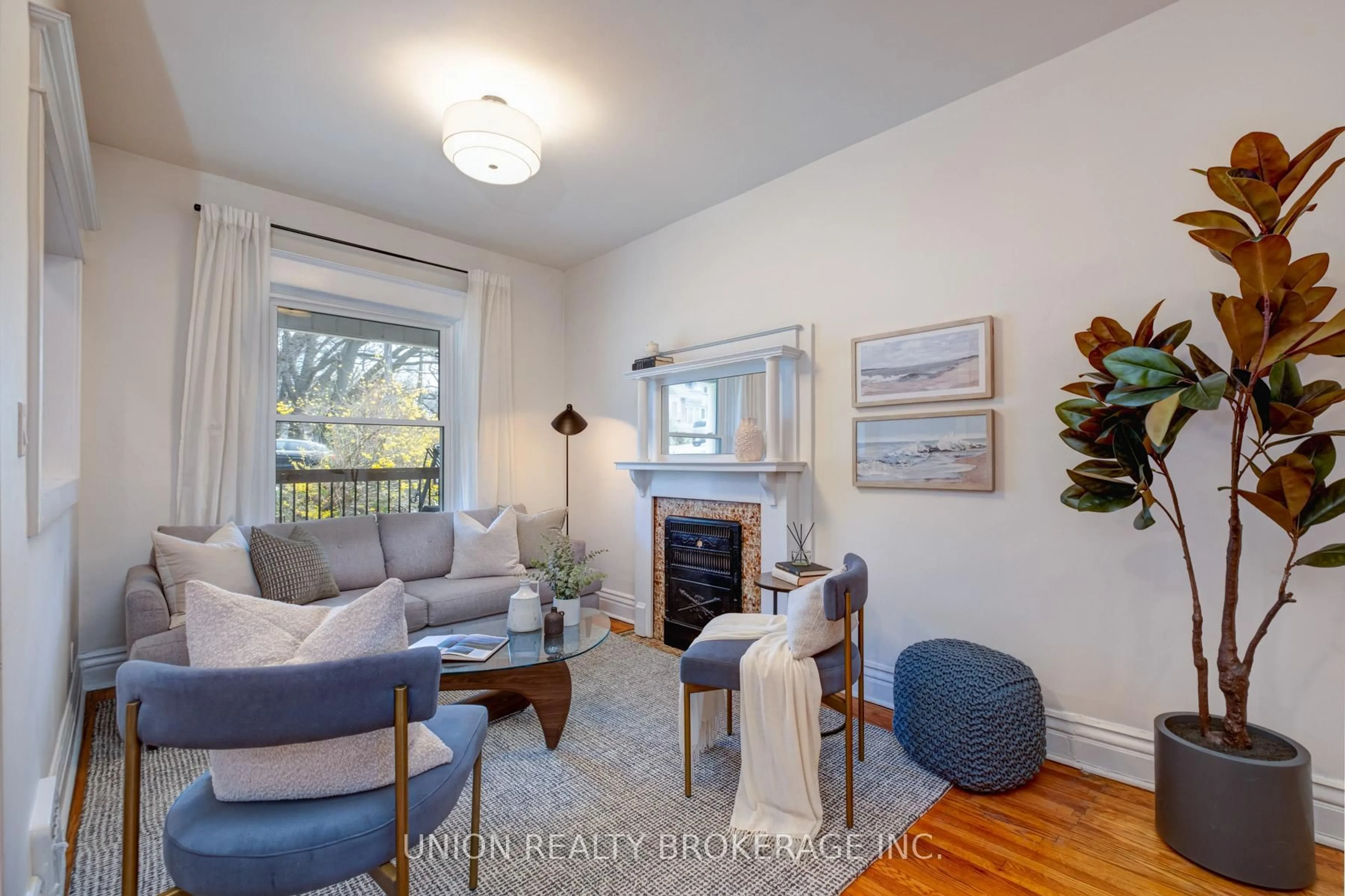 Living room with furniture, wood/laminate floor for 146 Beech Ave, Toronto Ontario M4E 3H6