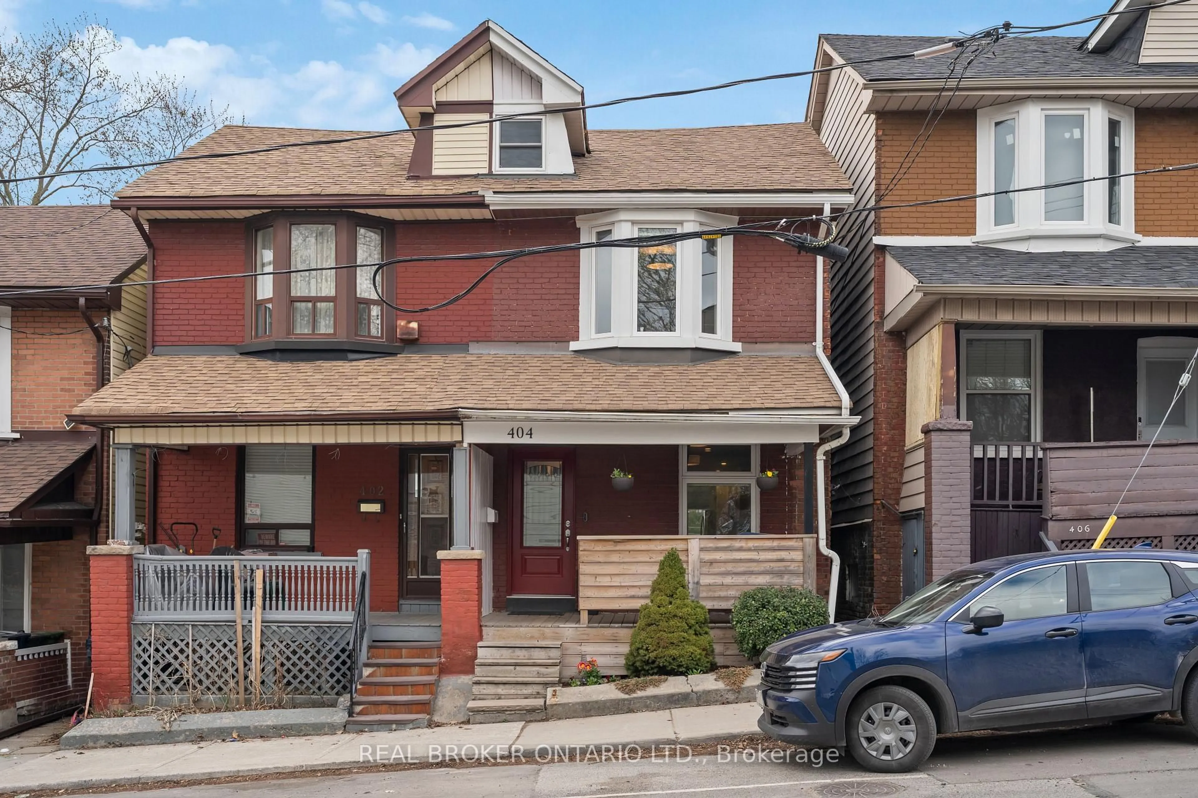Home with brick exterior material, street for 404 Jones Ave, Toronto Ontario M4J 3G3