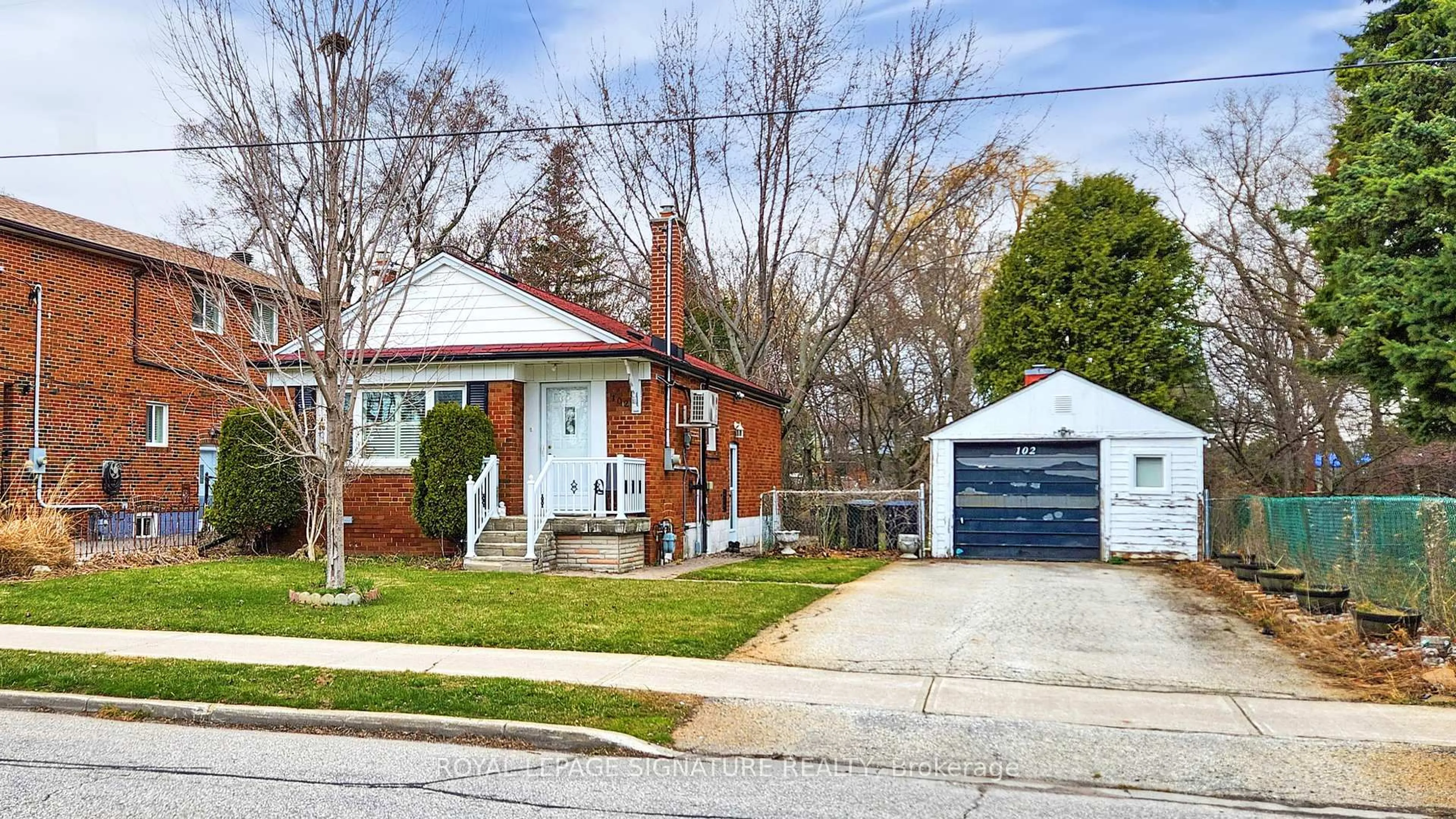 Home with brick exterior material, street for 102 Murray Glen Dr, Toronto Ontario M1R 3K2