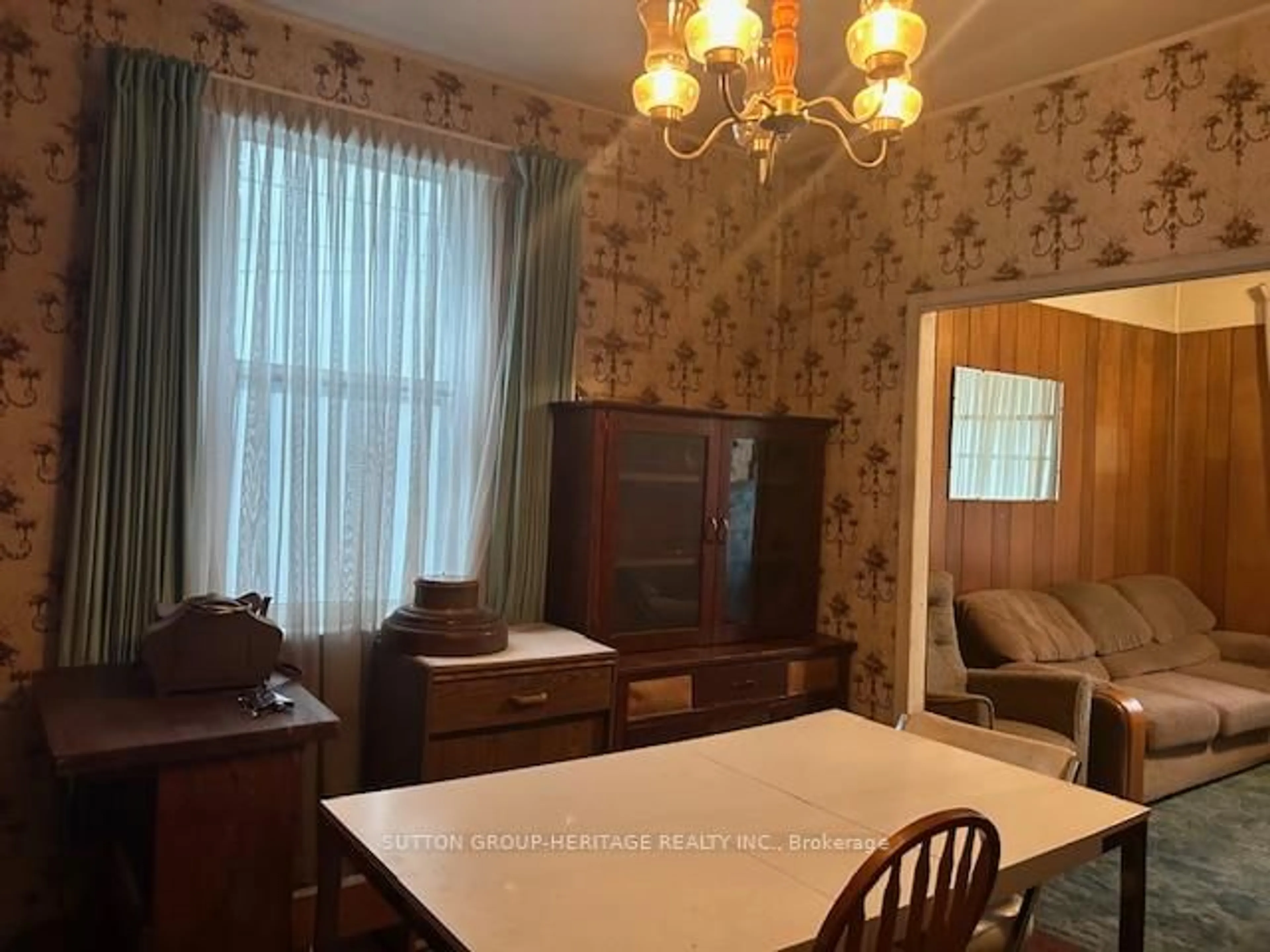 Dining room, wood/laminate floor for 1547 Dundas St, Toronto Ontario M4L 1K6