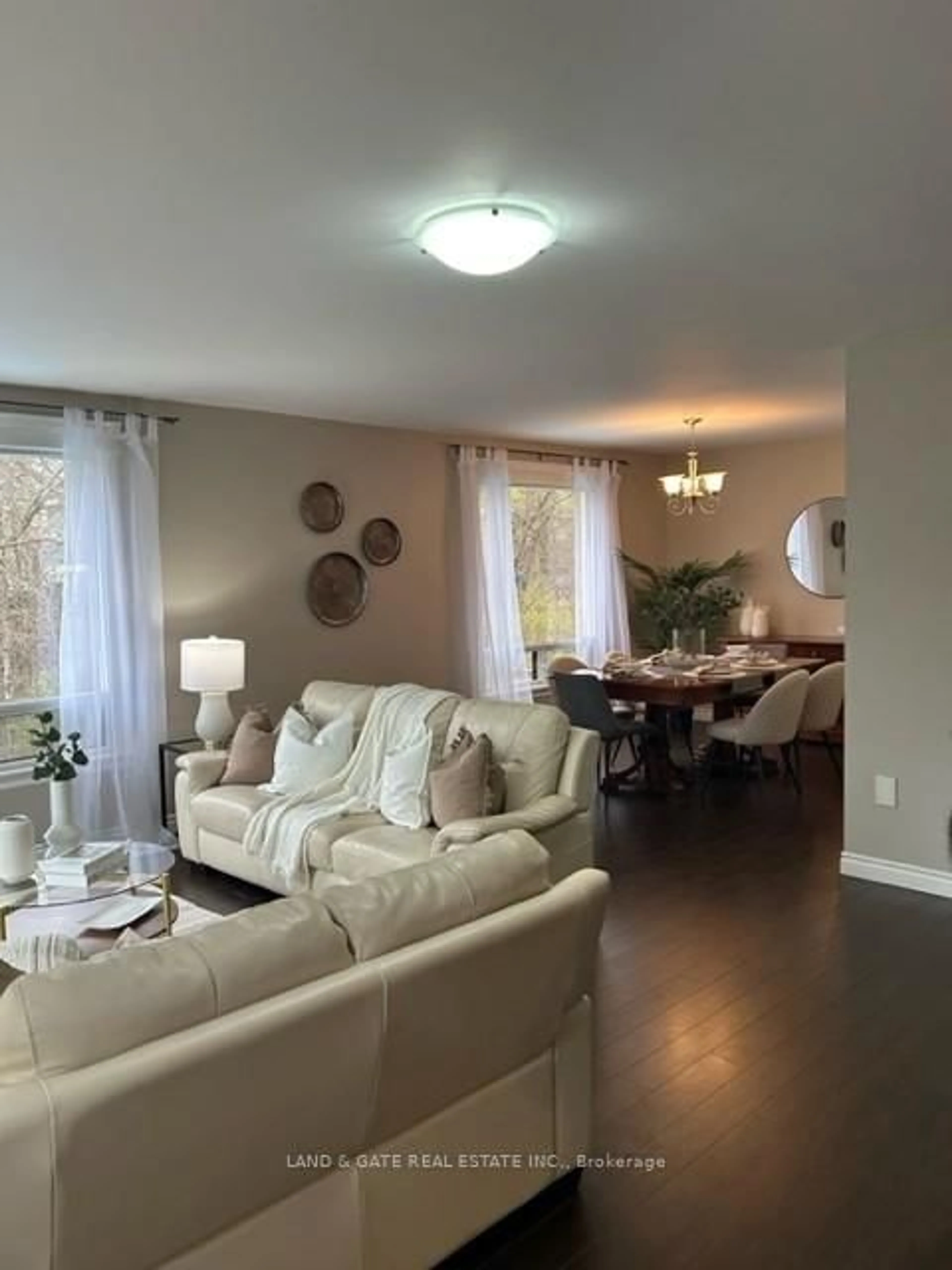 Living room with furniture, wood/laminate floor for 1038 Exeter St, Oshawa Ontario L1G 7E9