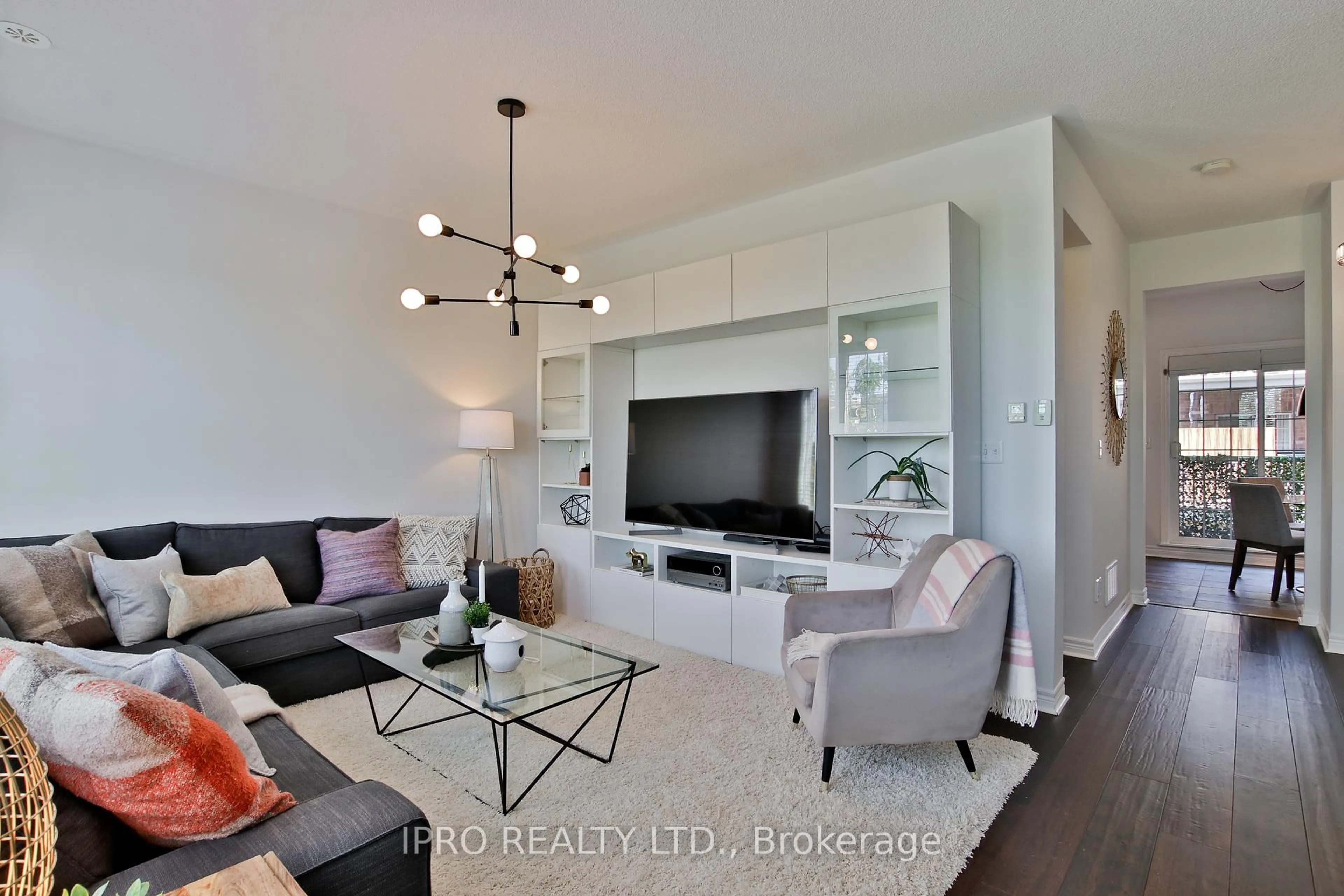 Living room with furniture, wood/laminate floor for 13 Brockville St, Toronto Ontario M4E 0A7