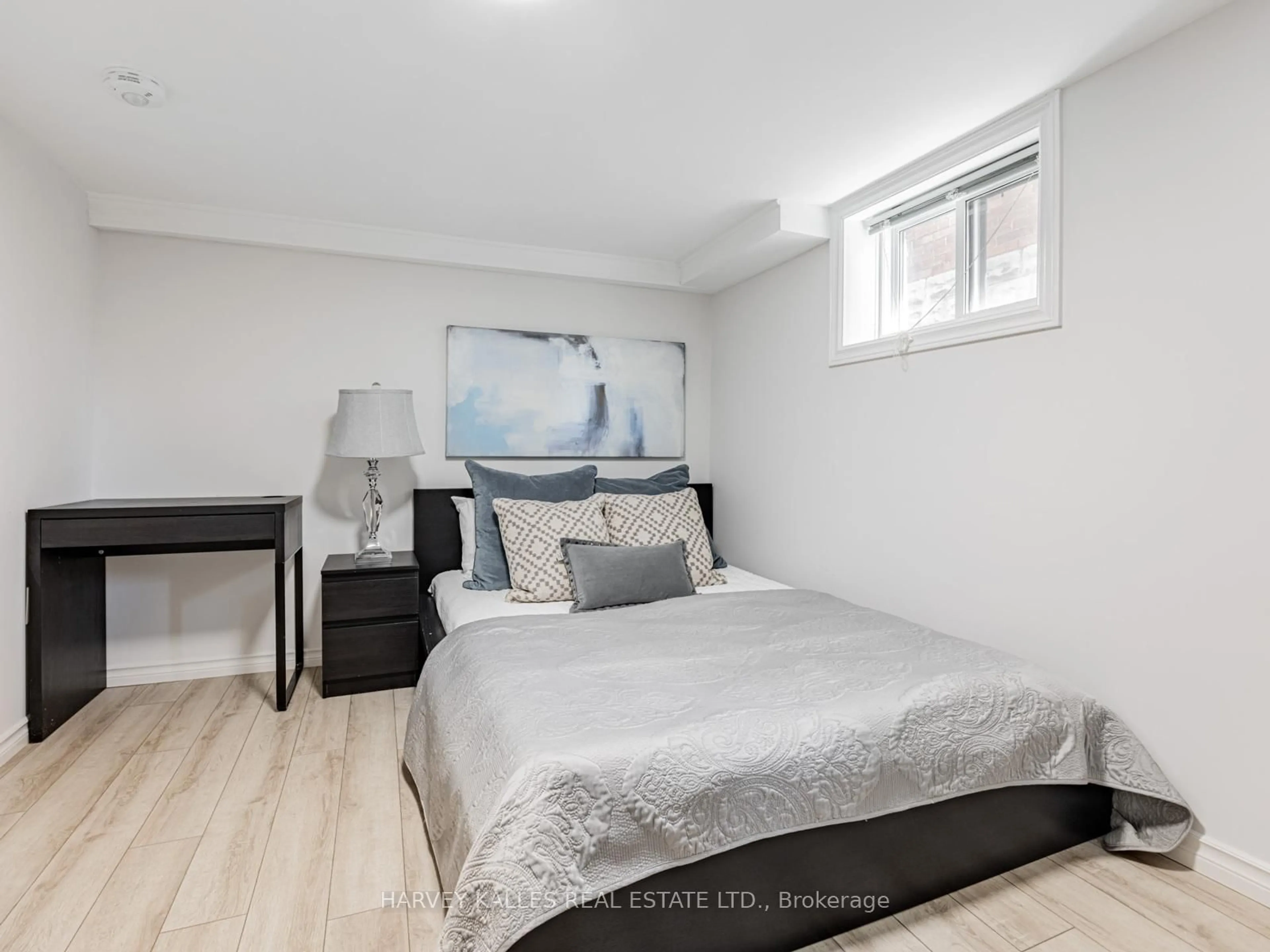 Bedroom with bed, wood/laminate floor for 511 Sammon Ave, Toronto Ontario M4J 2B3