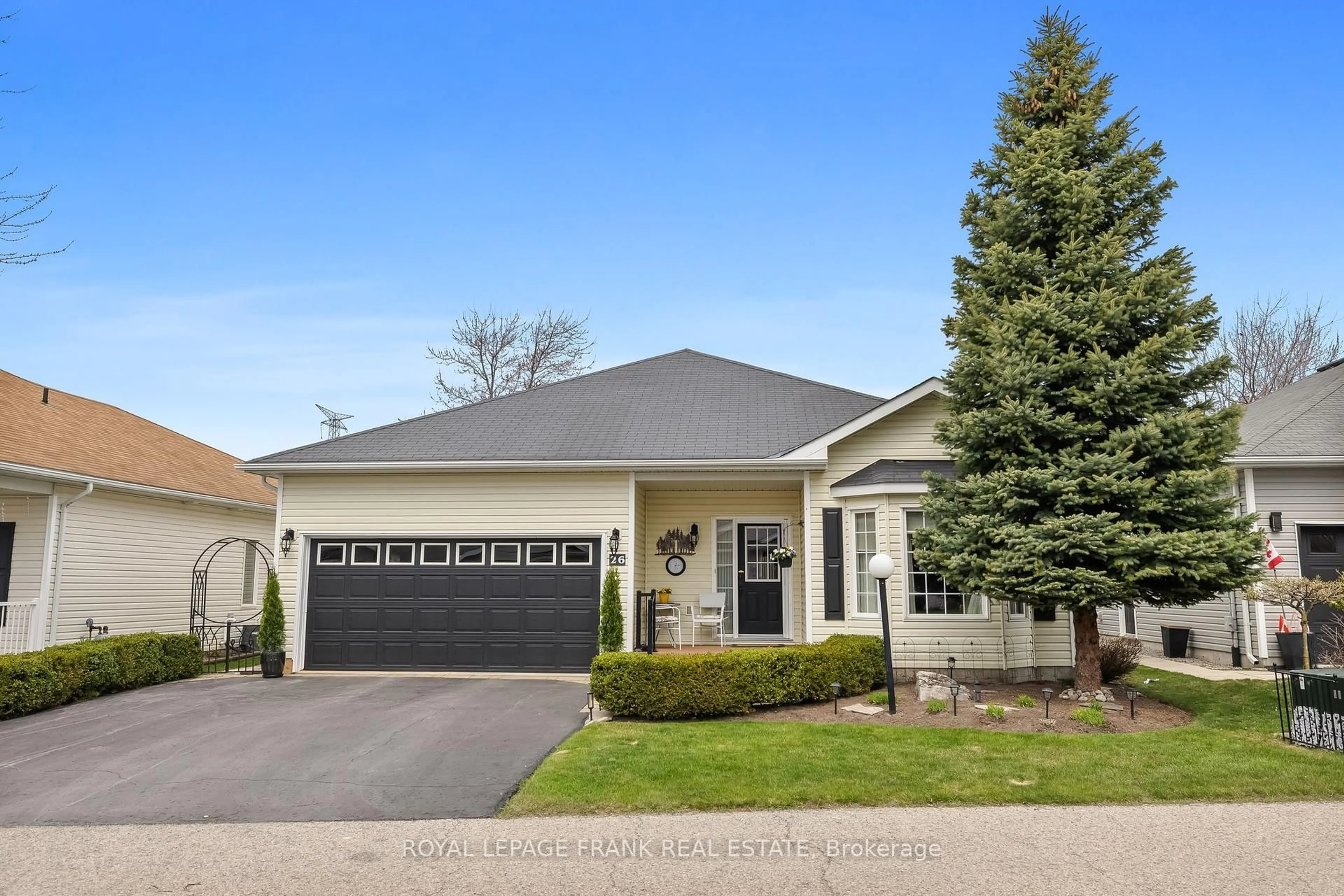 Home with vinyl exterior material, street for 26 KissingBridge Lane, Clarington Ontario L1B 0B2