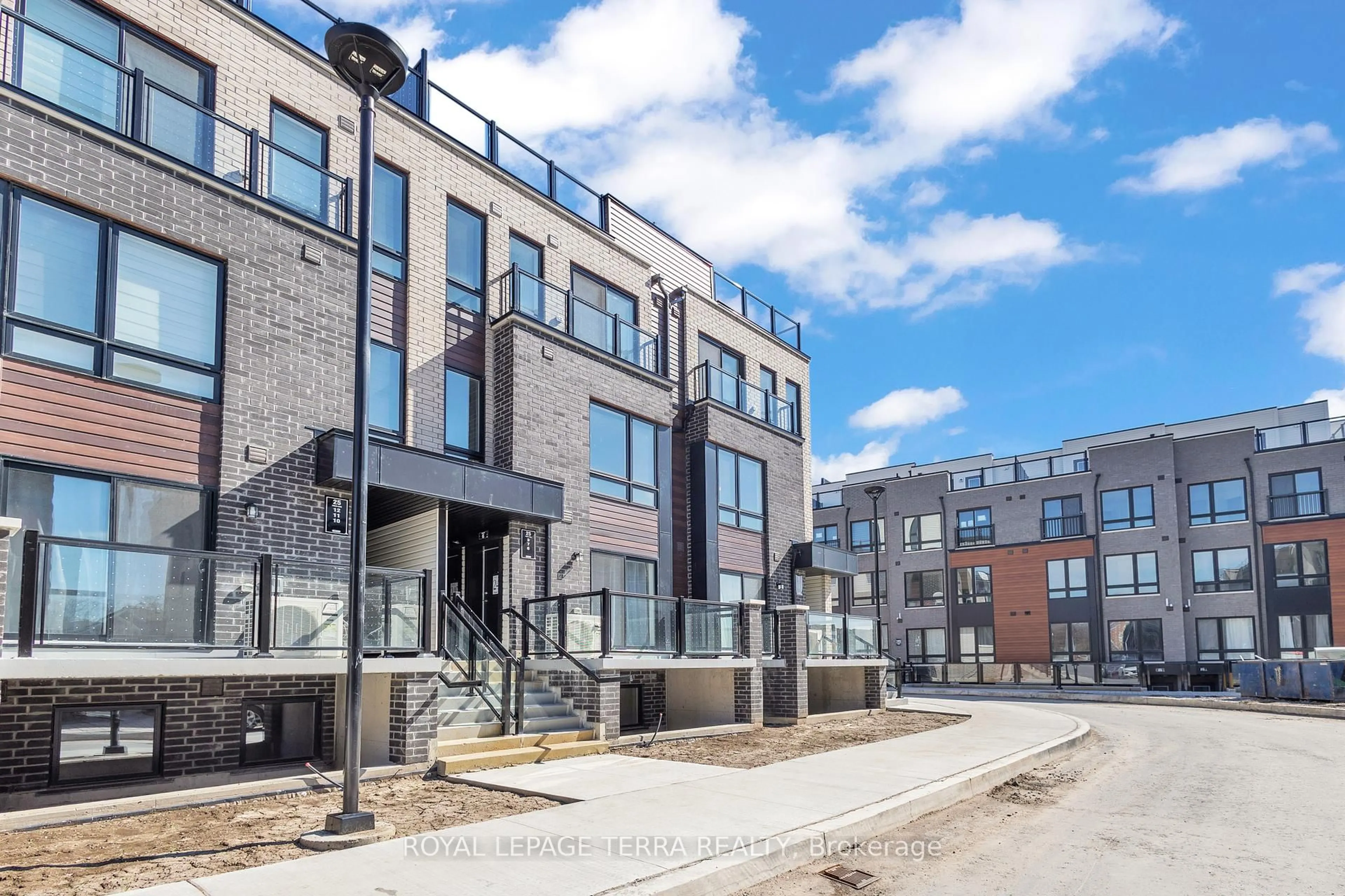 Home with brick exterior material, street for 25 Priya Lane #7, Toronto Ontario M1B 0E8