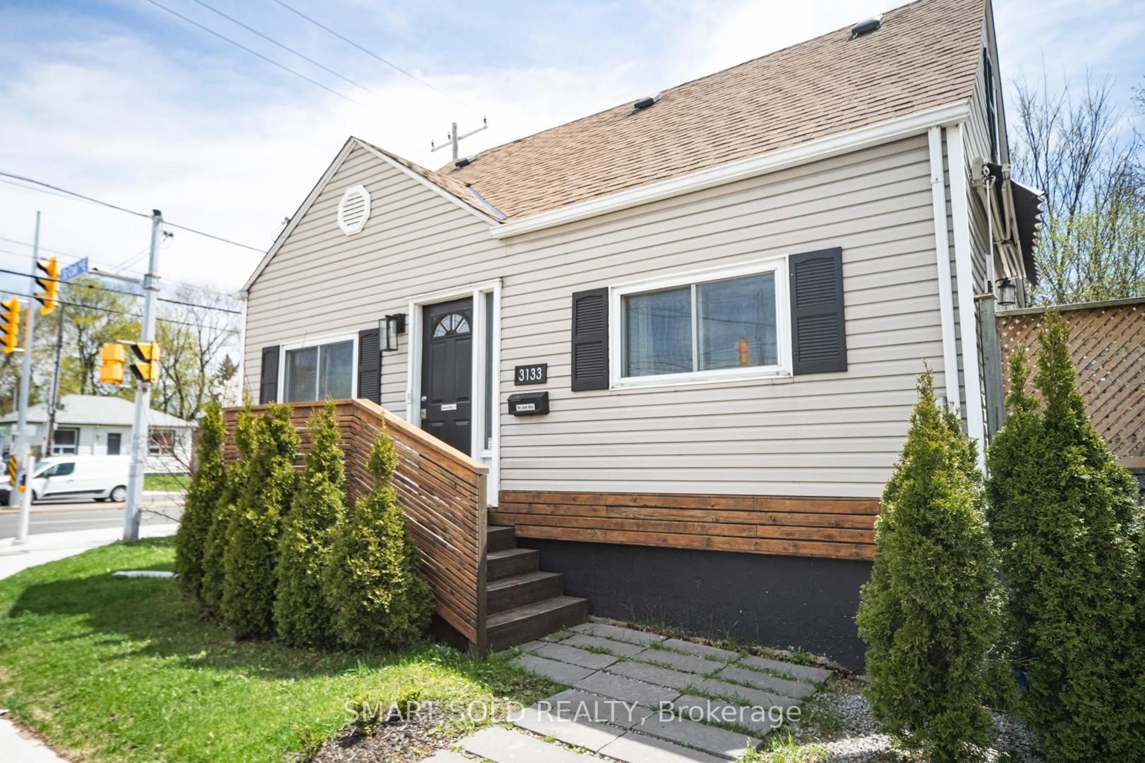 Home with vinyl exterior material, street for 3133 St. Clair Ave, Toronto Ontario M1L 1V2