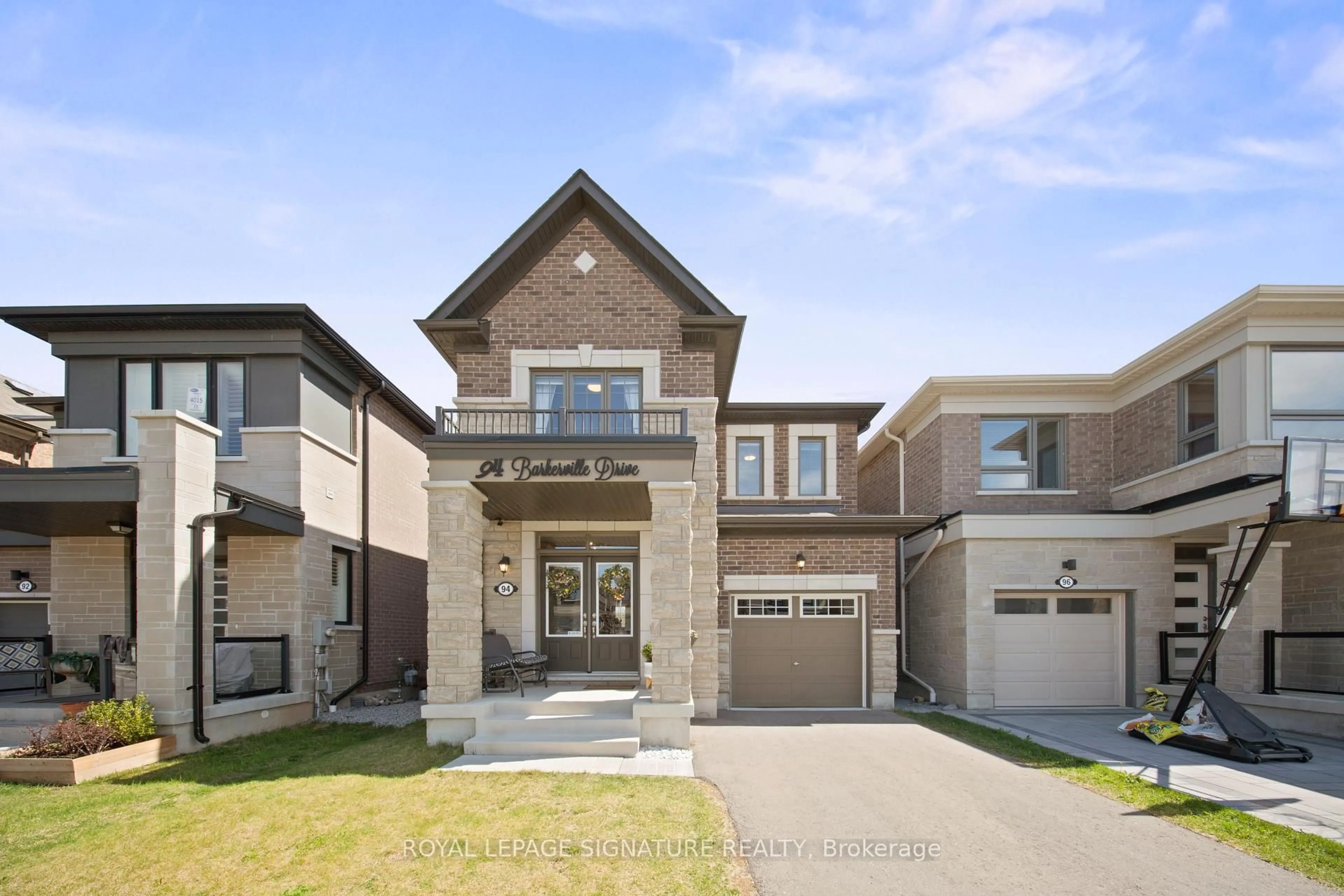 Home with brick exterior material, street for 94 Barkerville Dr, Whitby Ontario L1P 0L8